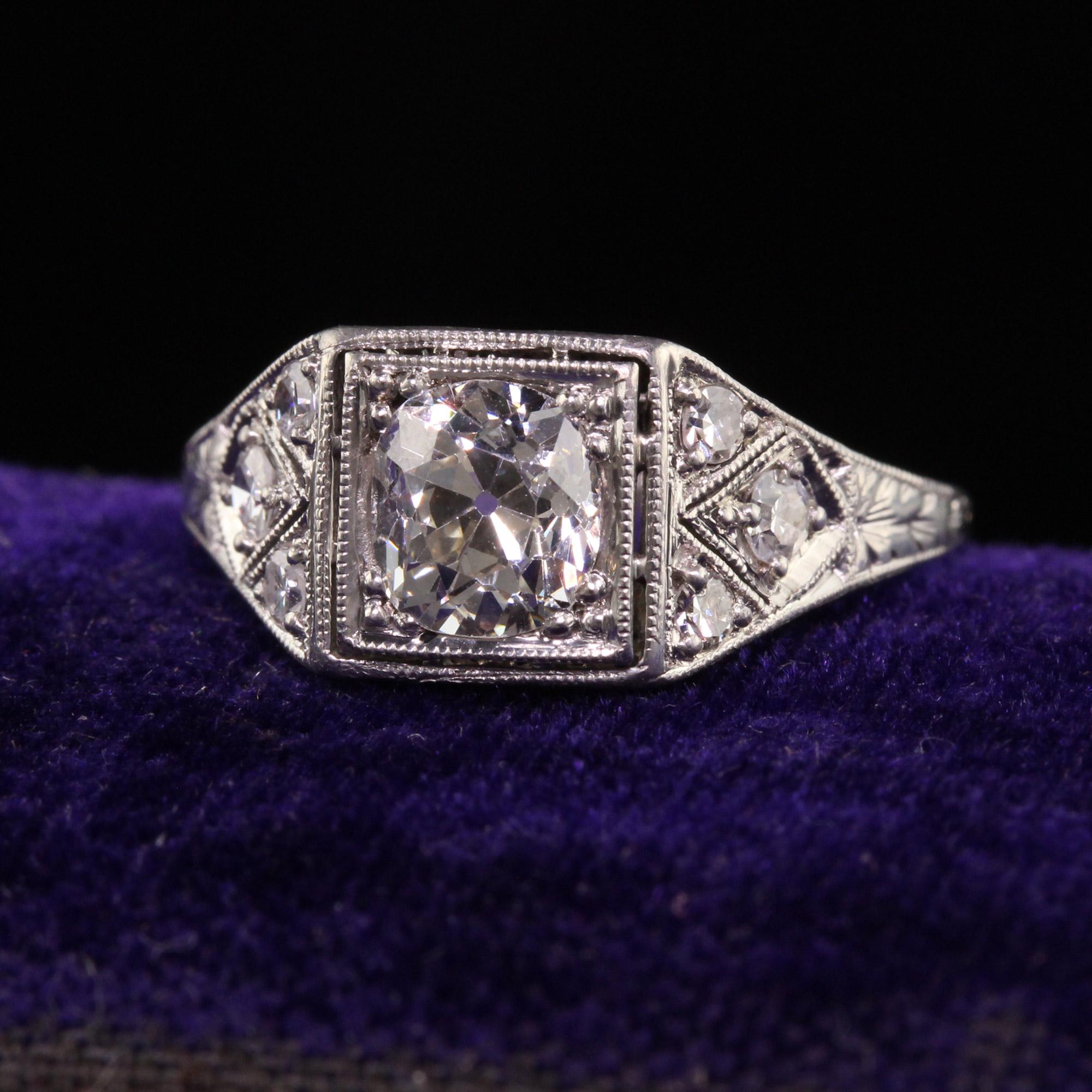 Beautiful Antique Art Deco Platinum Old Mine Diamond Filigree Engagement Ring. This gorgeous engagement ring is crafted in platinum. The center holds a beautiful old mine cut diamond and has old cut diamonds on the sides. The filigree and detail on