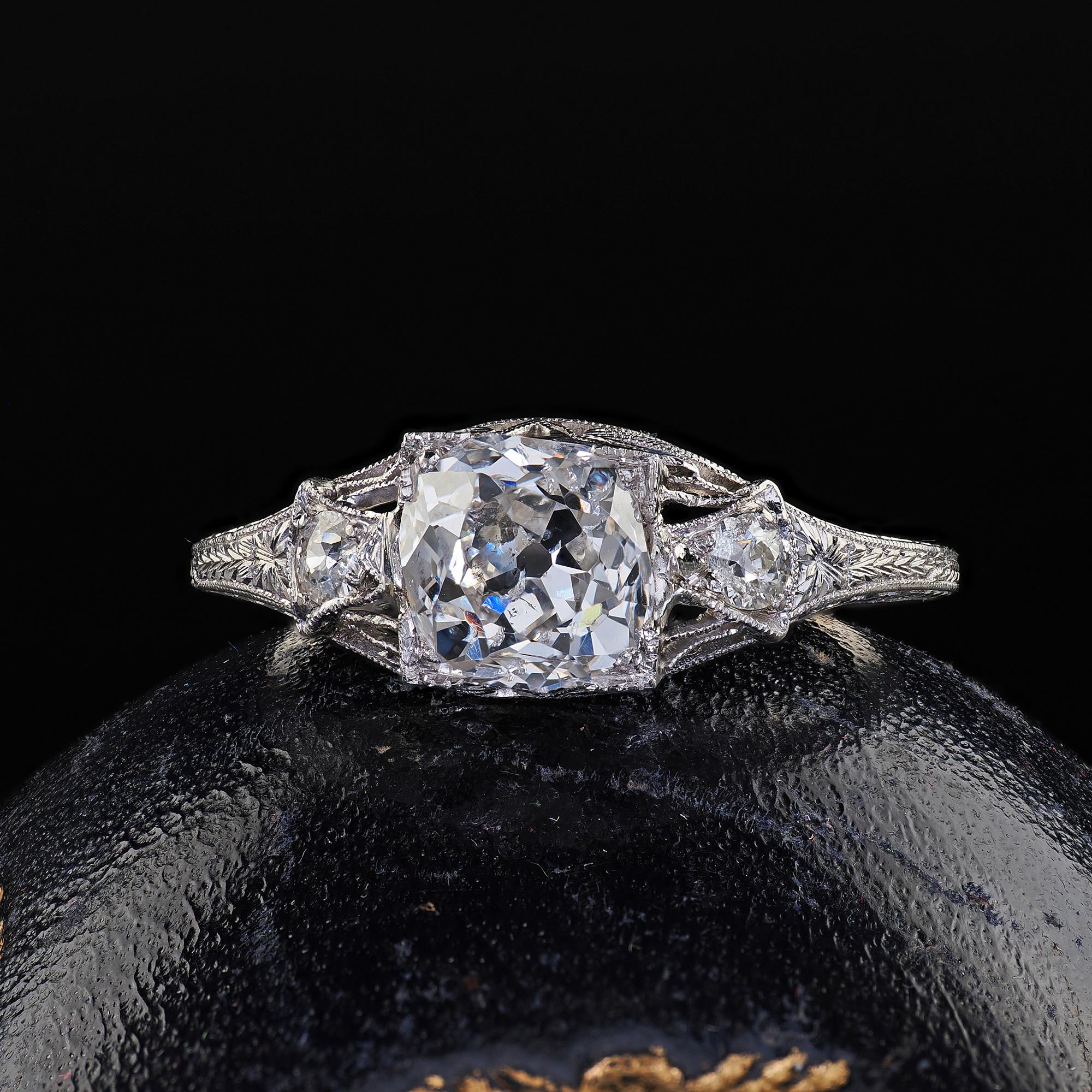 Beautiful Antique Art Deco Platinum Old Mine Diamond Filigree Engagement Ring. This gorgeous Art Deco old mine diamond engagement ring is crafted in platinum. The ring features a beautiful chunky old mine cut diamond in the center of a fabulous Art