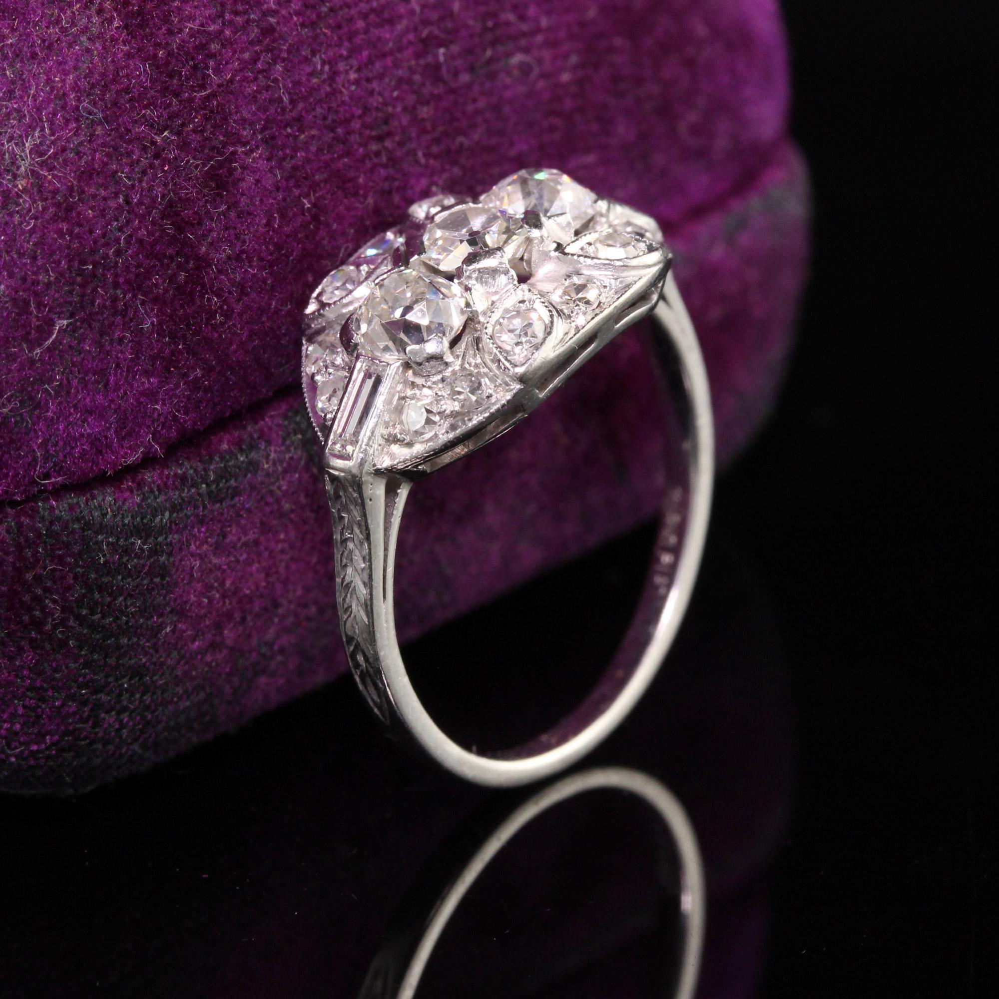 Beautiful Antique Art Deco Platinum Old Mine Diamond Three Stone Engagement Ring. This beautiful ring has 3 chunky old mine cut stones in a beautiful mounting that has single cut and baguette diamonds on it.

Item #R0818

Metal: Platinum

Diamond: