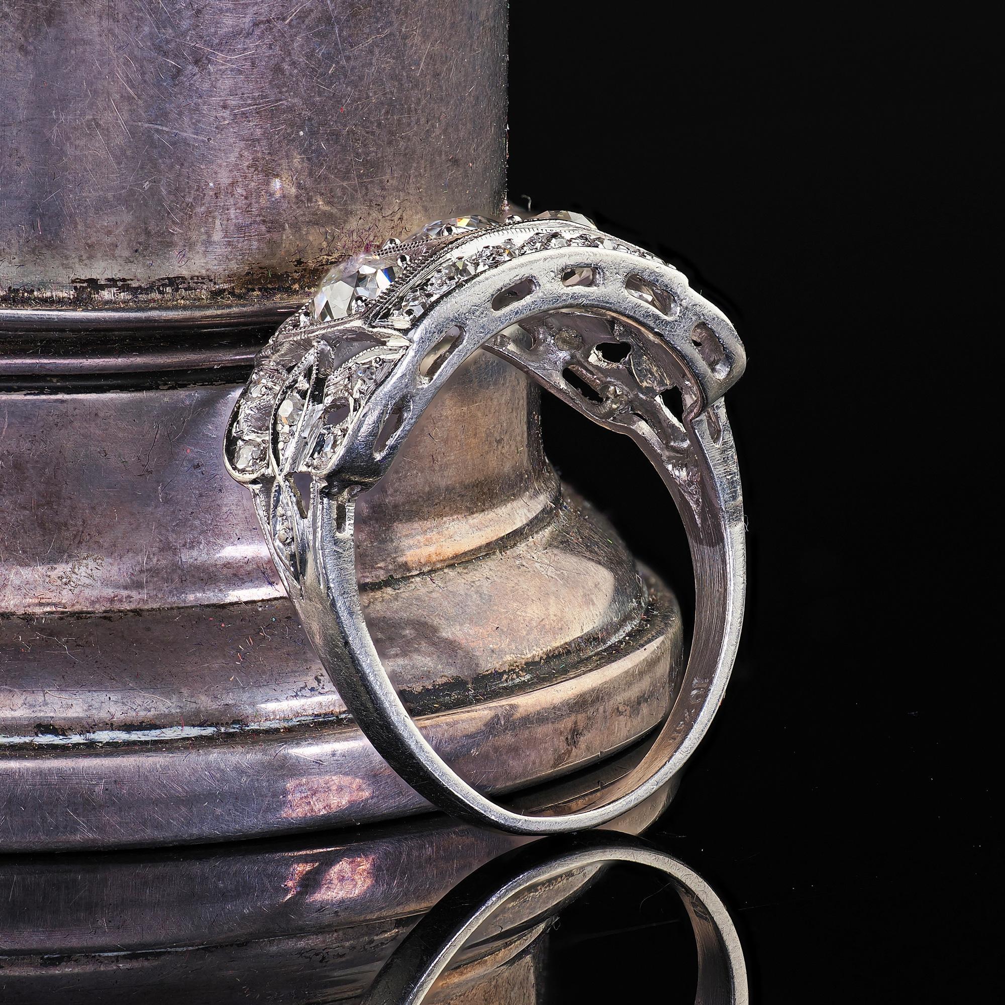 Old Mine Cut Antique Art Deco Platinum Old Mine Diamond Three Stone Ribbon Motif Ring For Sale