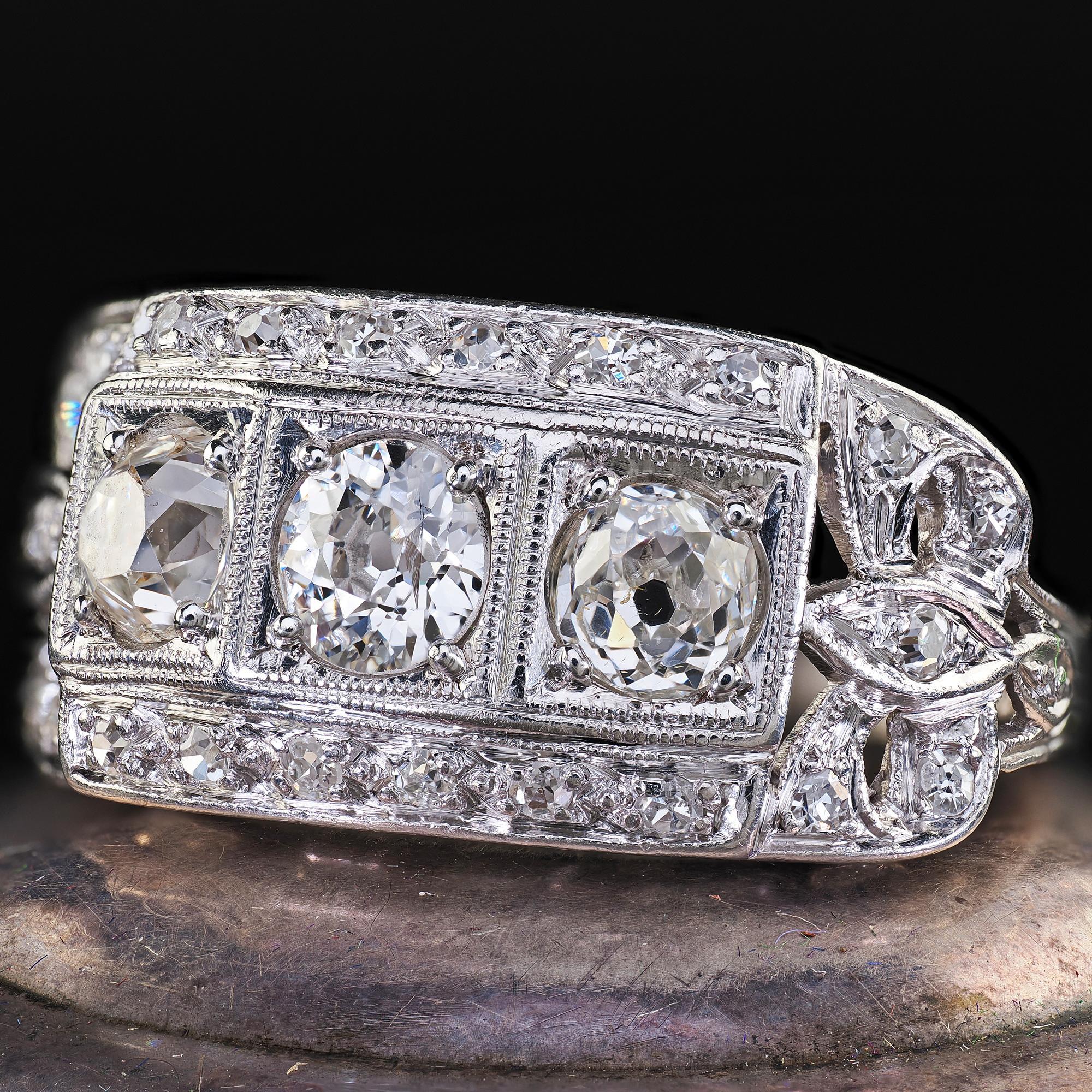 Antique Art Deco Platinum Old Mine Diamond Three Stone Ribbon Motif Ring For Sale 1