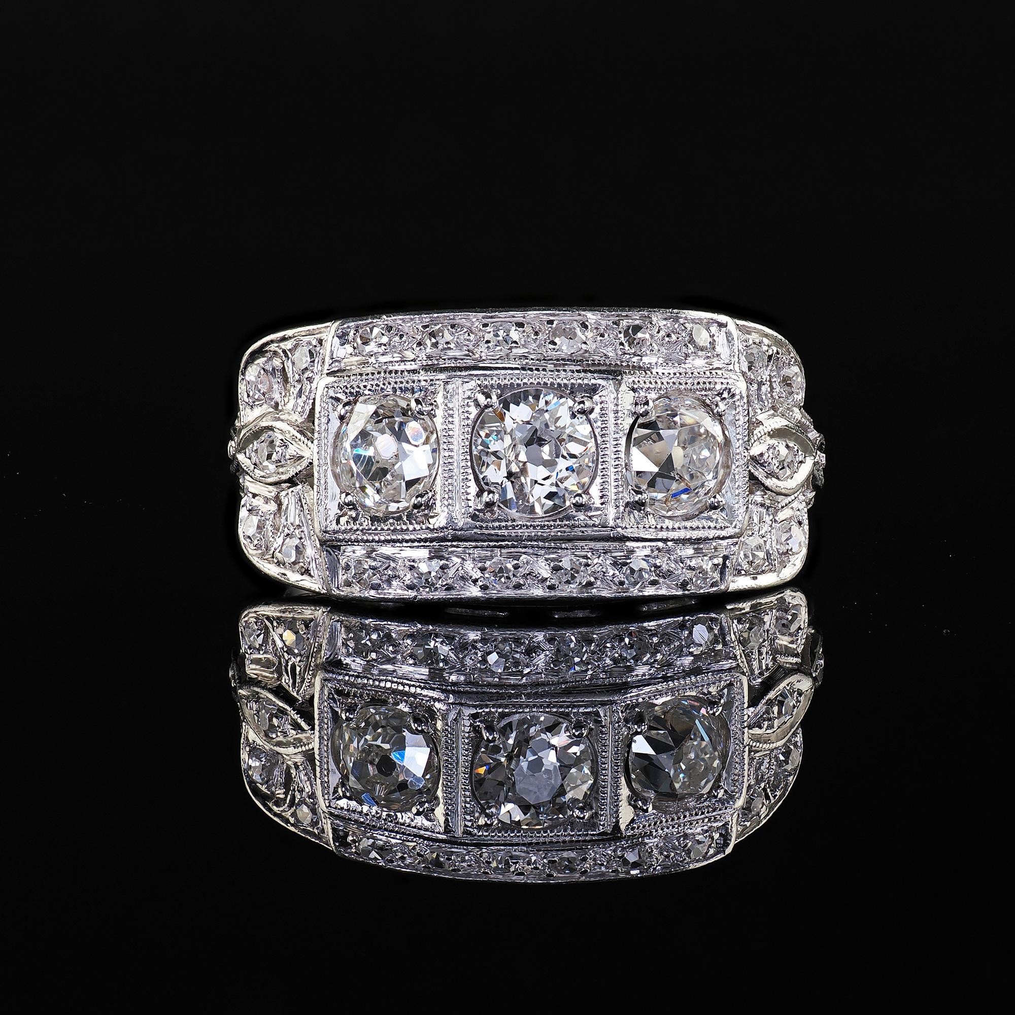 Antique Art Deco Platinum Old Mine Diamond Three Stone Ribbon Motif Ring For Sale 2