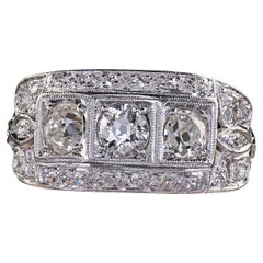 Antique Art Deco Platinum Old Mine Diamond Three Stone Ribbon Motif Ring