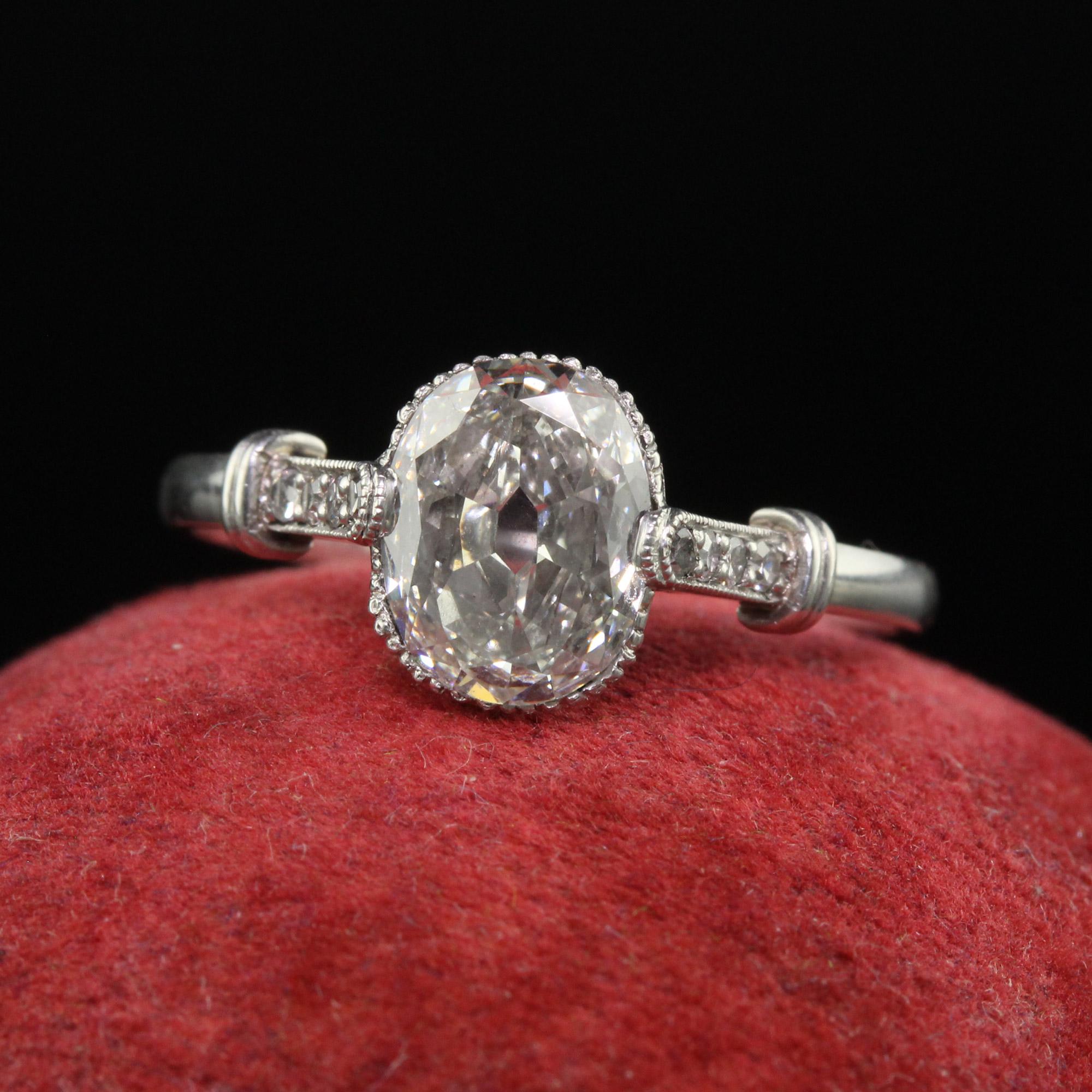 Beautiful Antique Art Deco Platinum Old Oval Cut Diamond Engagement Ring. This gorgeous antique engagement ring is crafted in platinum. The center holds a beautiful old cut oval diamond that is very charming. It is set in a gorgeous filigree art