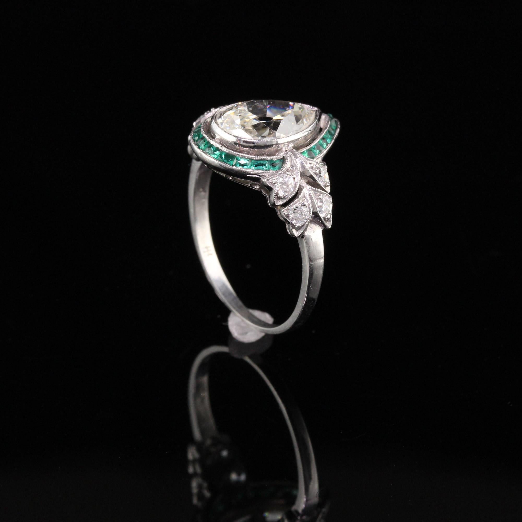 Antique Art Deco Platinum Old Pear Shape Diamond Emerald Halo Engagement Ring In Good Condition In Great Neck, NY
