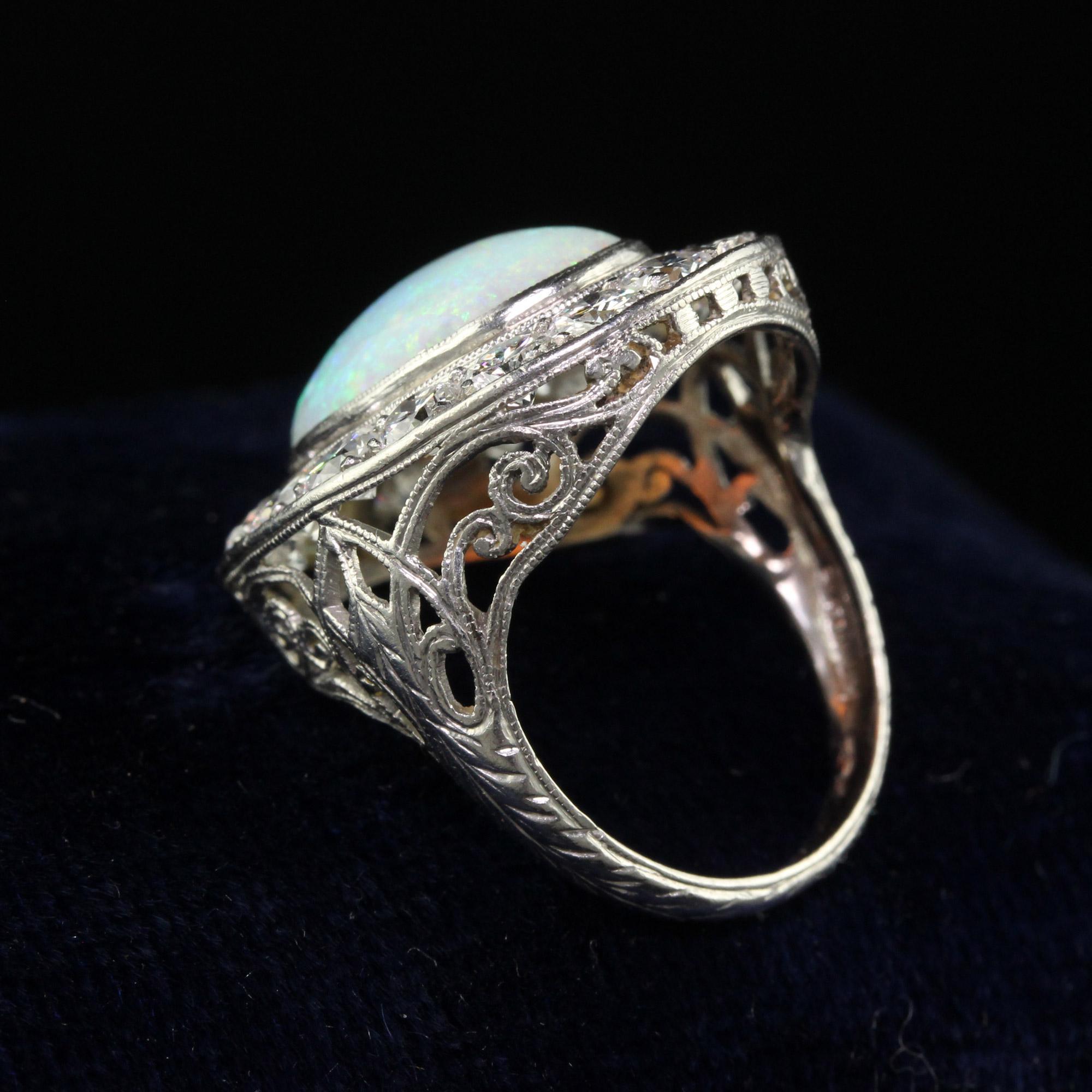 Old European Cut Antique Art Deco Platinum Opal and Old Euro Diamond Halo Cocktail Ring For Sale