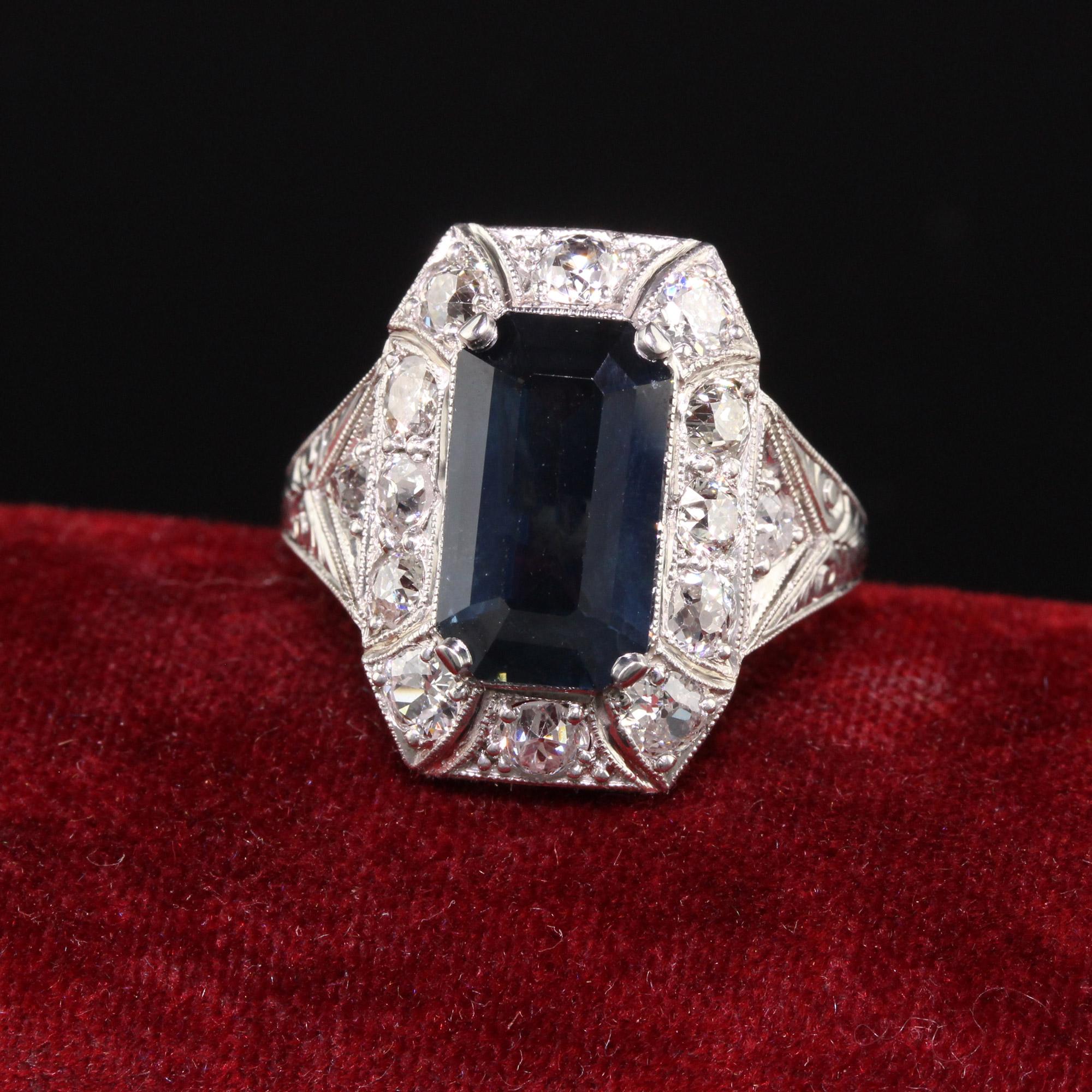 Beautiful Antique Art Deco Platinum Sapphire and Old European Diamond Cocktail Ring. This beautiful cocktail ring is crafted in platinum. The center holds a natural emerald cut sapphire and is surrounded by old european cut diamonds. The ring has