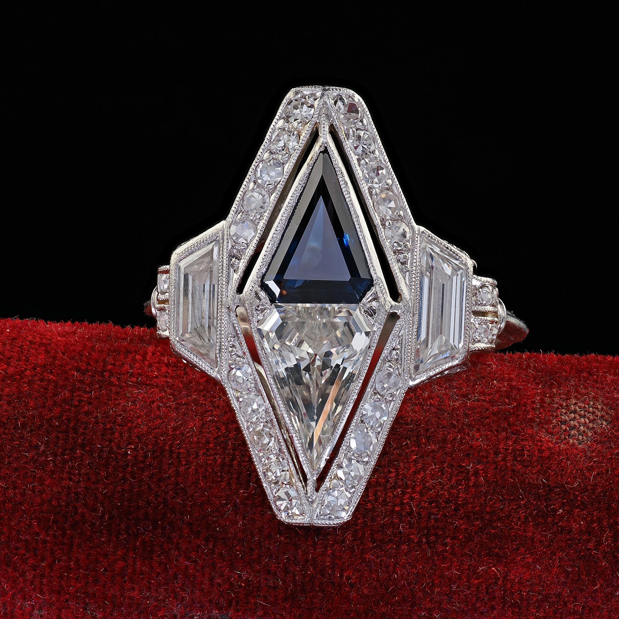 Beautiful Antique Art Deco Platinum Shield Cut Diamond Sapphire Filigree Cocktail Ring. This amazing Art Deco diamond and sapphire filigree cocktail ring is crafted in platinum. The ring features a large old shield cut diamond and sapphire in the
