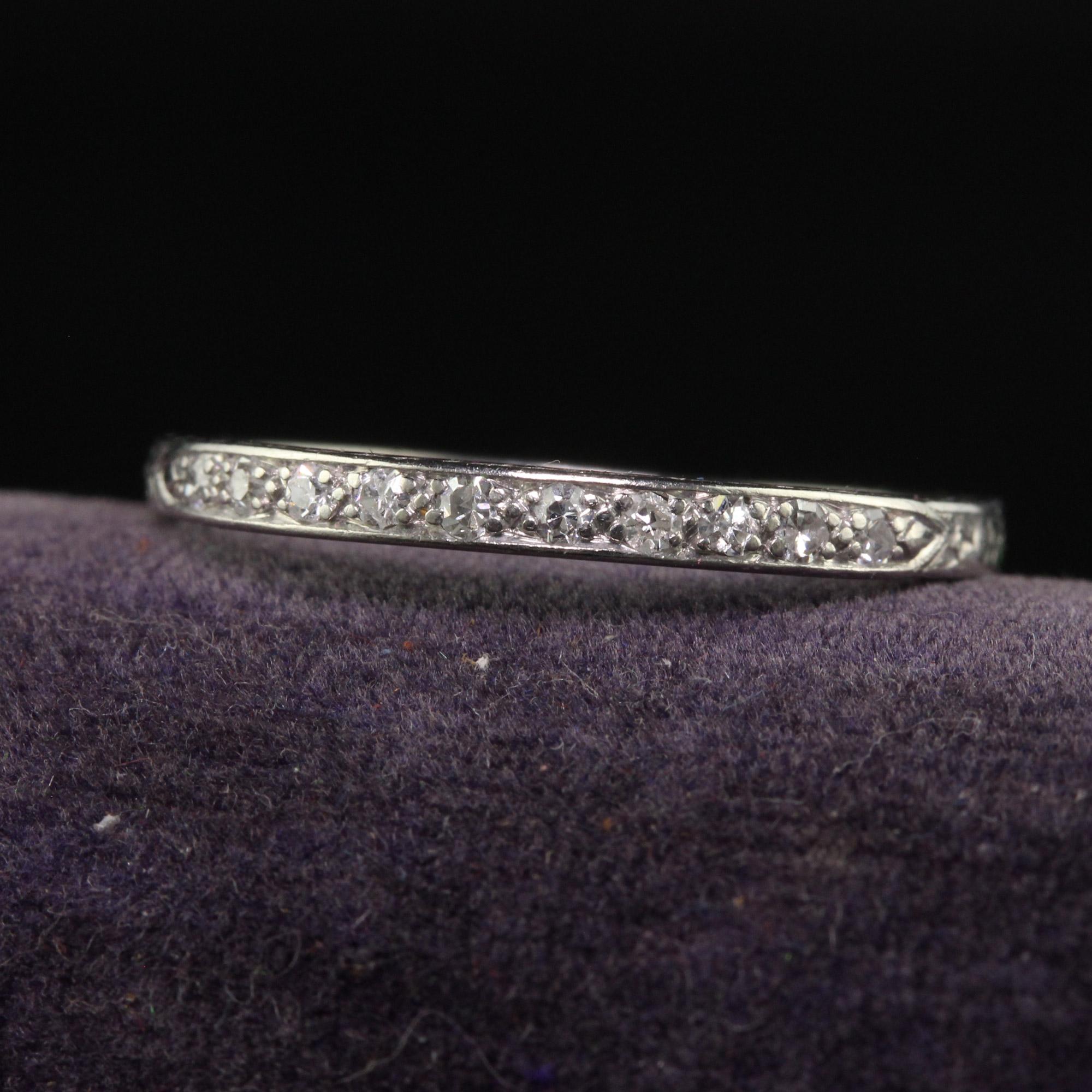 Beautiful Antique Art Deco Platinum Single Cut Diamond Engraved Wedding Band - Size 8 1/4. This gorgeous and classic wedding band is crafted in platinum. The top of the ring has white single cut diamonds set half way across the top. All sides of the