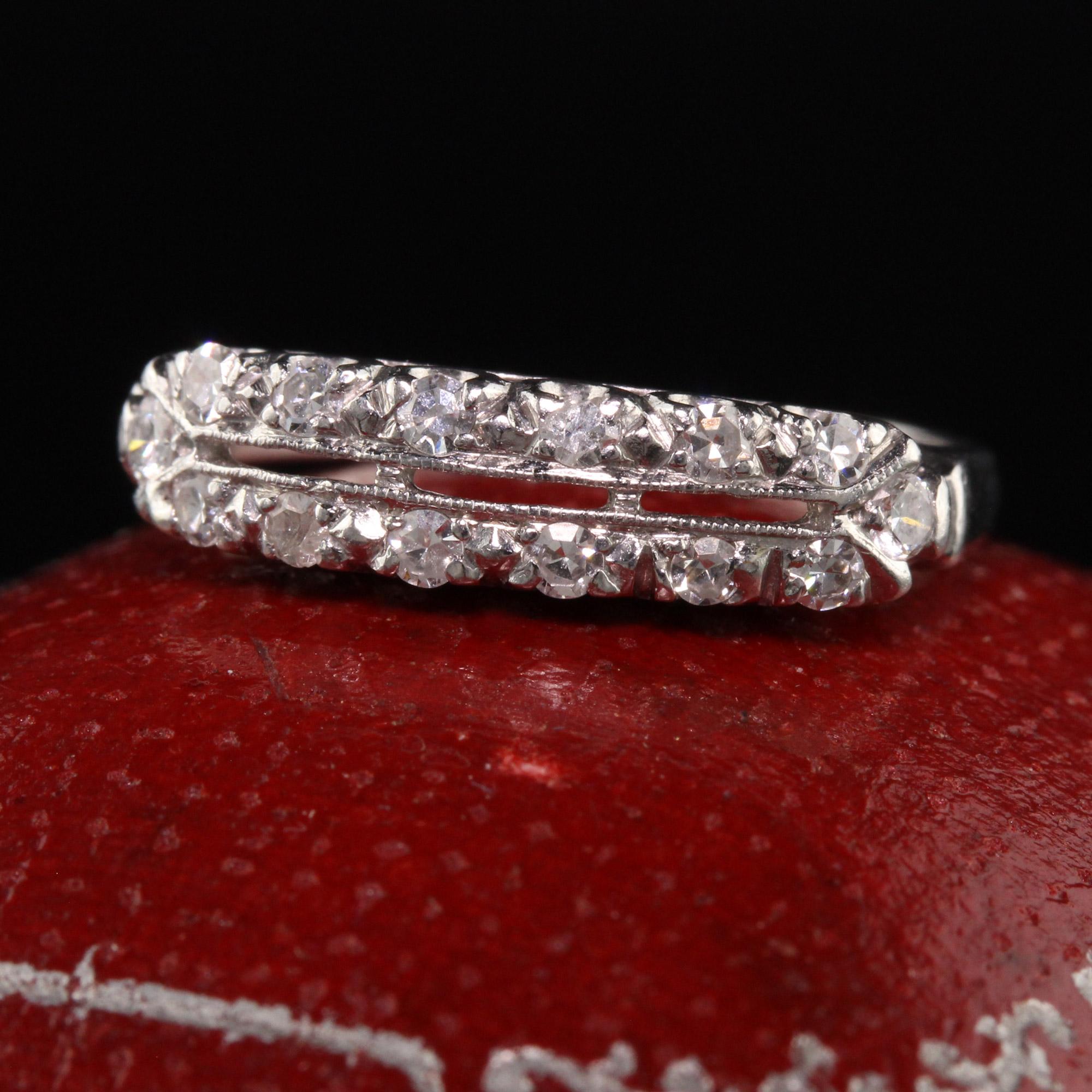 Beautiful Antique Art Deco Platinum Single Cut Diamond Filigree Wedding Band. This beautiful wedding band is crafted in platinum. The top of the ring holds single cut diamonds in a beautiful filigree design.

Item #R1229

Metal: Platinum

Weight: