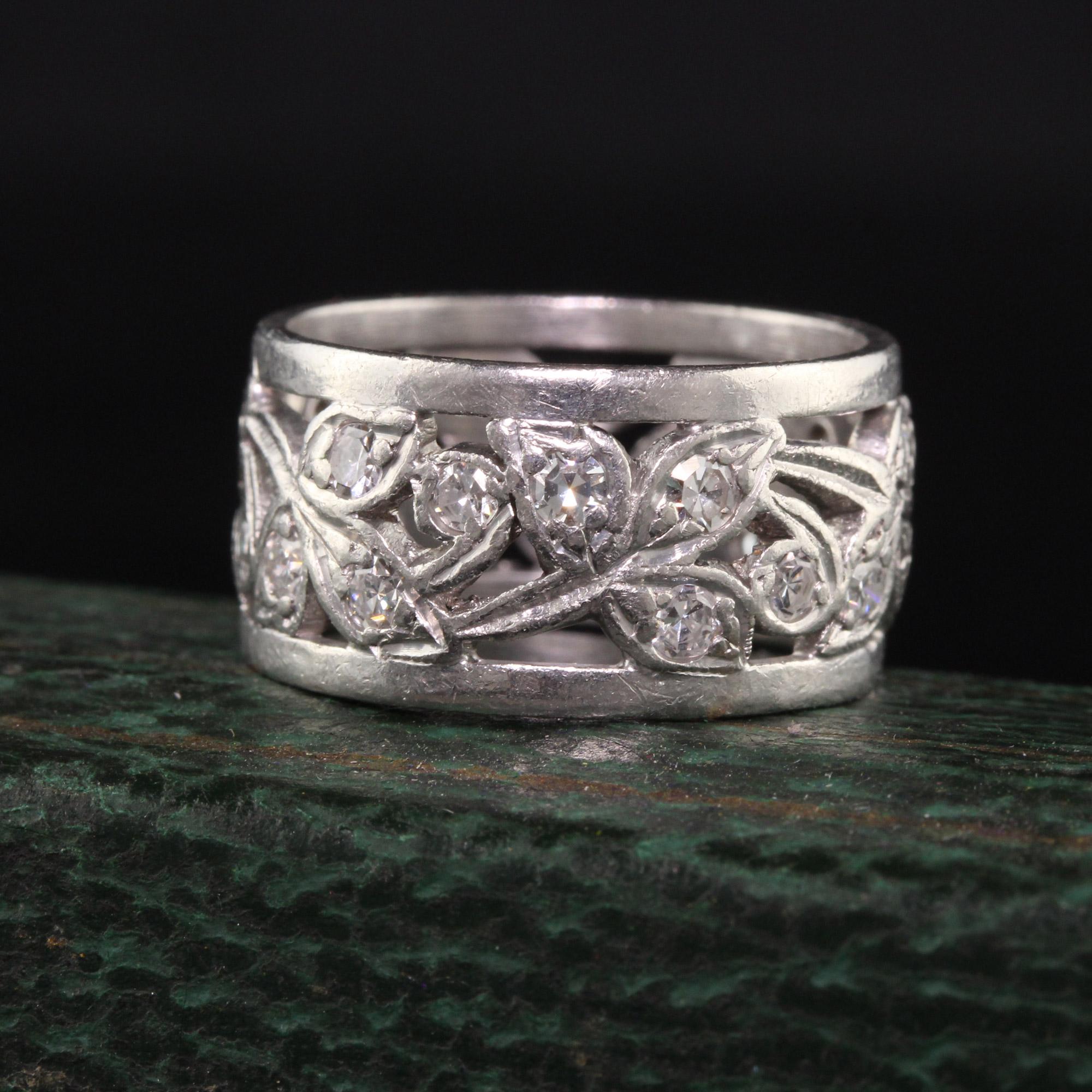 Beautiful Antique Art Deco Platinum Single Cut Diamond Floral Wide Eternity Band. This gorgeous band is crafted in platinum. There are single cut diamonds set in the flowers going around the entire ring. The ring is in good condition and is