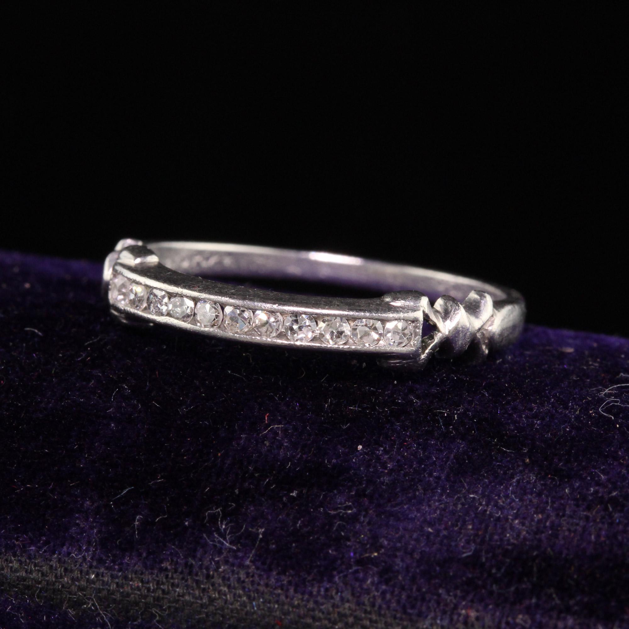 Beautiful Antique Art Deco Platinum Single Cut Diamond Wedding Band. This beautiful wedding band features single cut diamonds on the top of the ring with ribbon accents on the sides.

Item #R1120

Metal: Platinum

Weight: 2.8 Grams

Size: