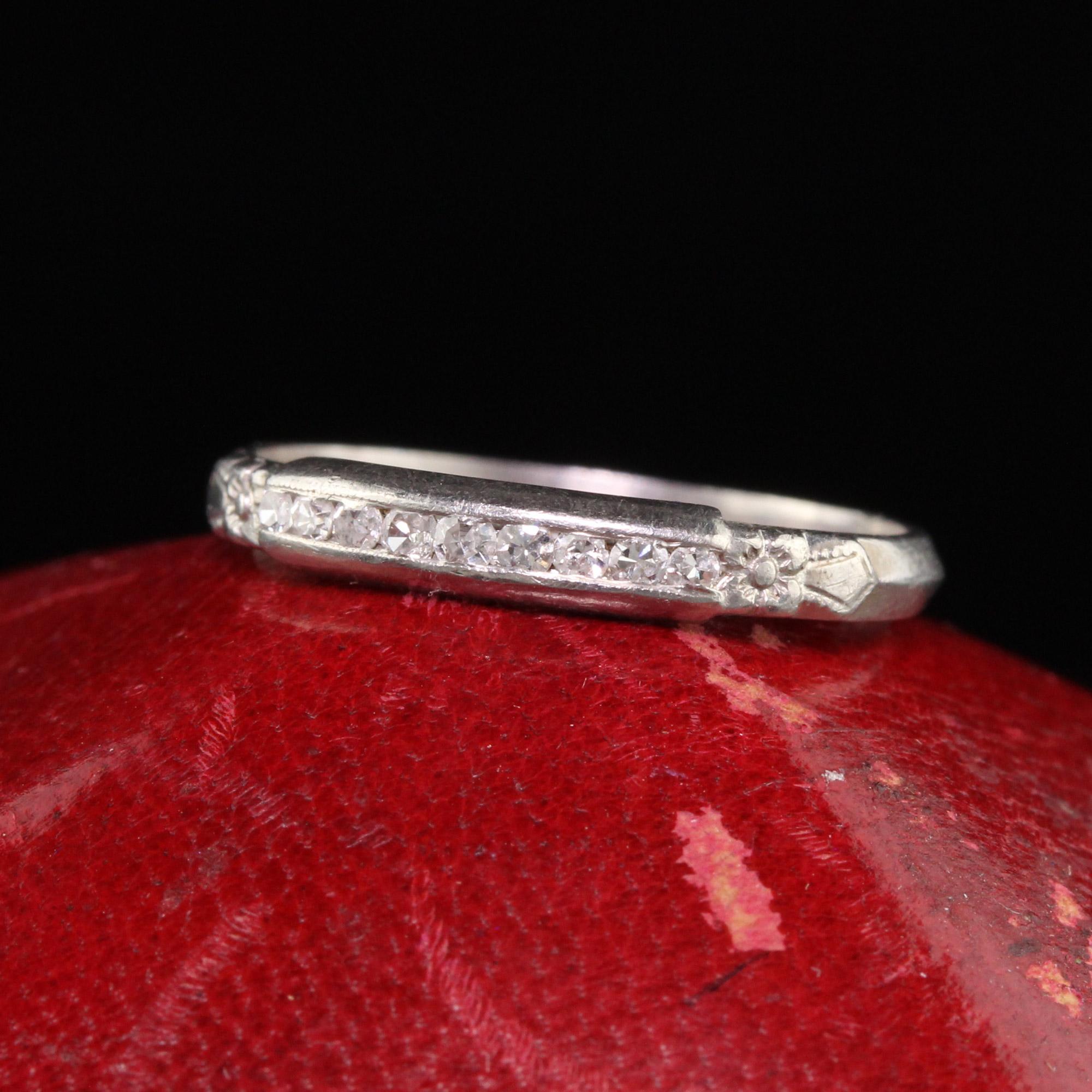 Beautiful Antique Art Deco Platinum Single Cut Diamond Wedding Band. This classic wedding band features single cut stones set in the center of a platinum mounting that has engraved flower blossoms on each side.

Item #R1109

Metal: Platinum

Weight: