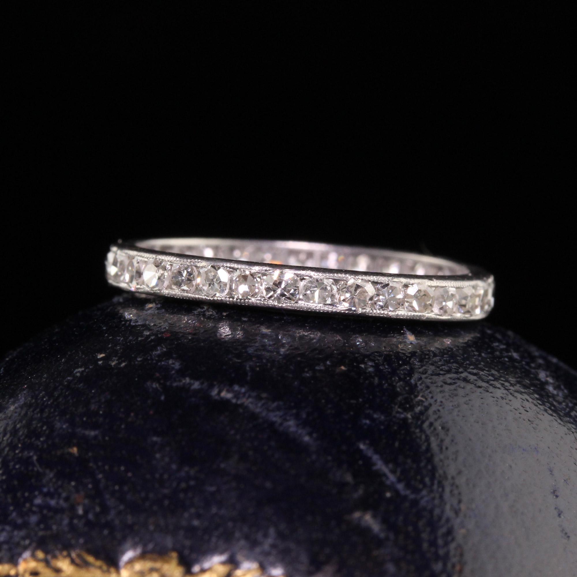 Beautiful Antique Art Deco Platinum Single Cut Diamond Wedding Eternity Band - Size 5 1/2. This incredible wedding band is crafted in platinum. There are single cut diamonds going around the entire ring and has milgrain on the edges of the channels.