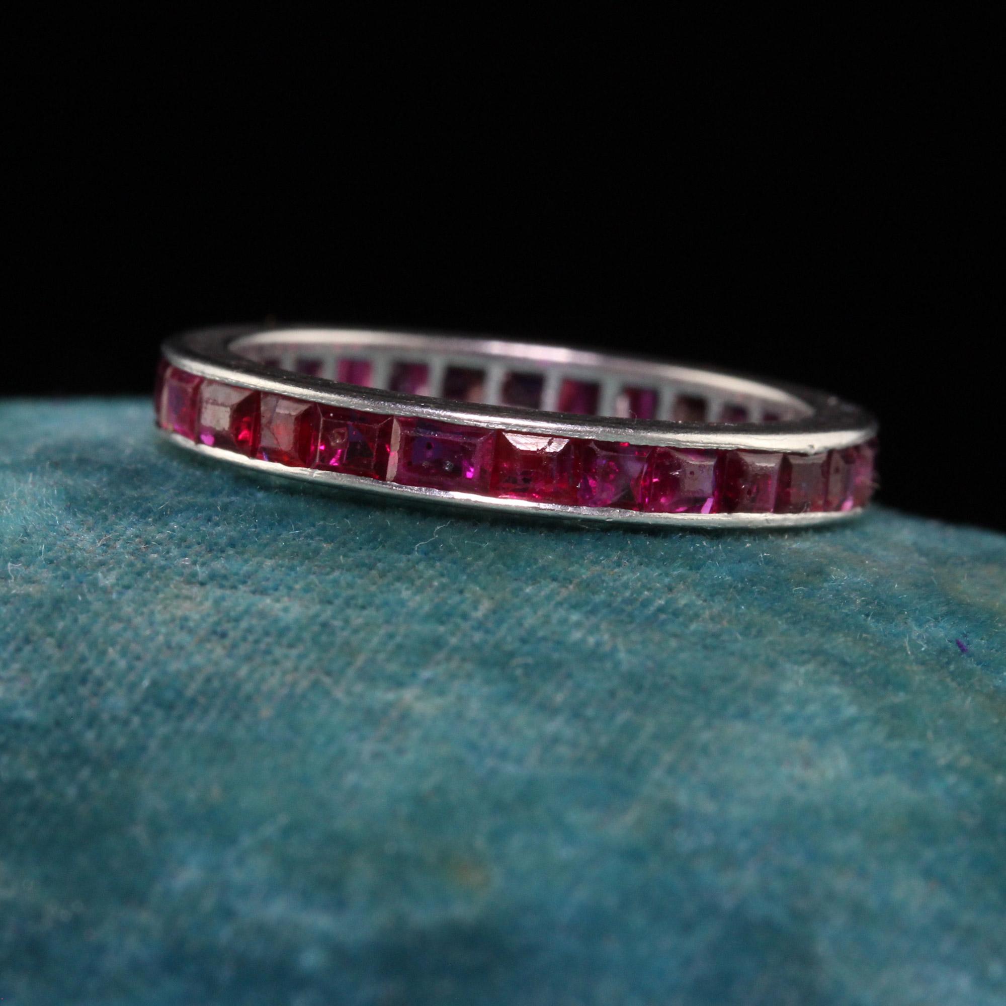 Beautiful Antique Art Deco Platinum Square Cut Ruby Eternity Band - Size 5 1/2. This beautiful band is crafted in platinum. There are square cut rubies going around the entire ring and the sides of the ring are plain. The ring is in good condition