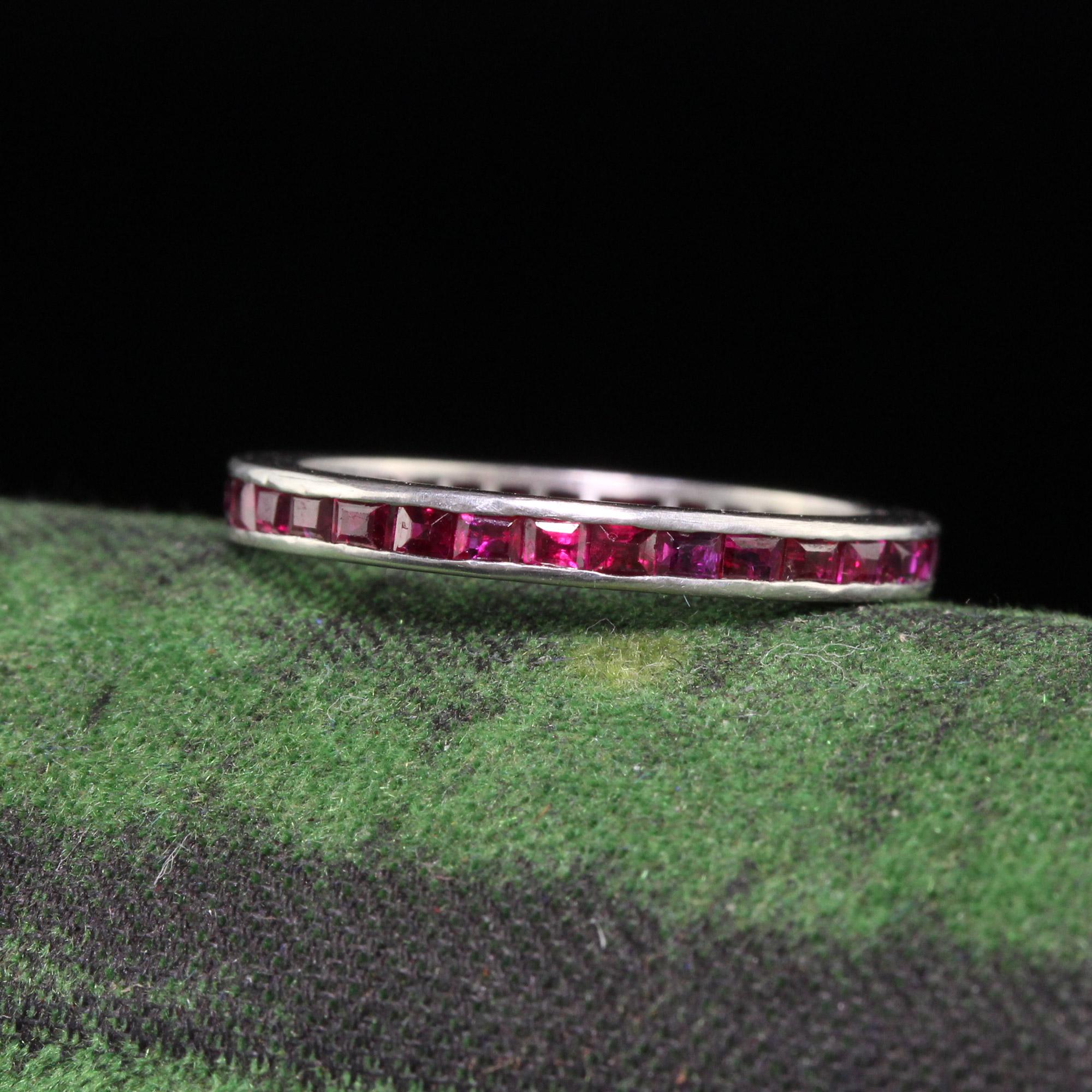 Beautiful Antique Art Deco Platinum Square Cut Ruby Eternity Band - Size 4. This beautiful band is crafted in platinum. The ring features natural square cut rubies going around the entire band. The ring is in good condition and ready to wear.

Item