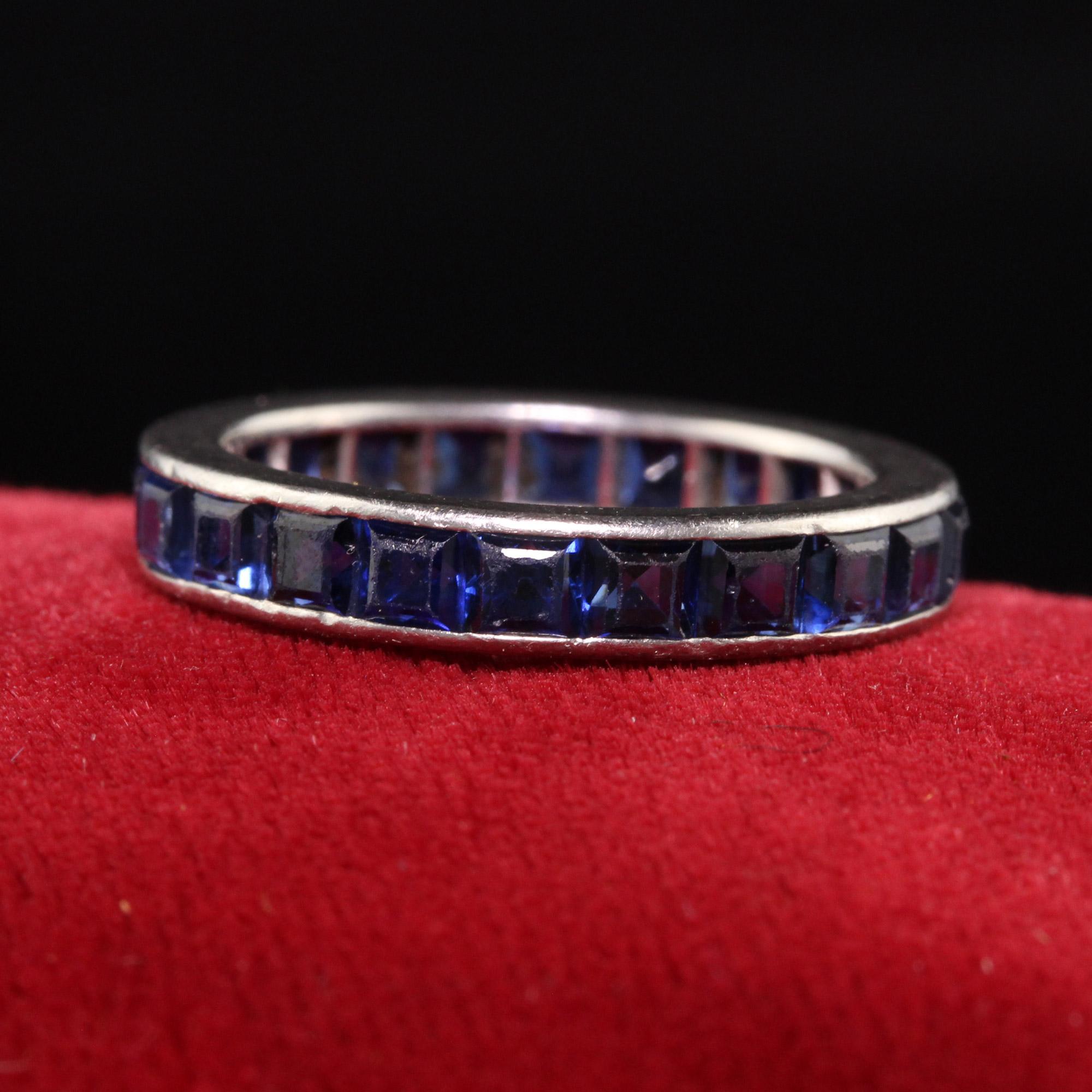 Beautiful Antique Art Deco Platinum Square Cut Sapphire Eternity Band. This incredible wedding band is crafted in platinum and has large square cut sapphires going around the entire ring.

Item #R1189

Metal: Platinum

Weight: 4.2 Grams

Size: 6