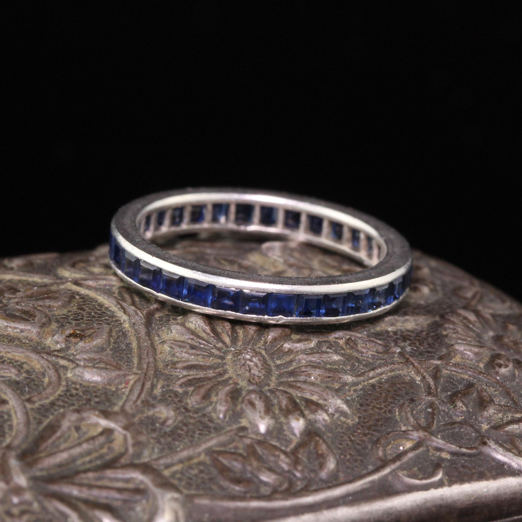 Gorgeous Art Deco Tiffany & Co platinum sapphire eternity band with square cut sapphires. The ring is in good condition. 

#R0349

Metal: Platinum 

Weight: 2.5 Grams

Ring Size: 5

*Unfortunately this ring cannot be sized.

Measurements: 2.63 mm