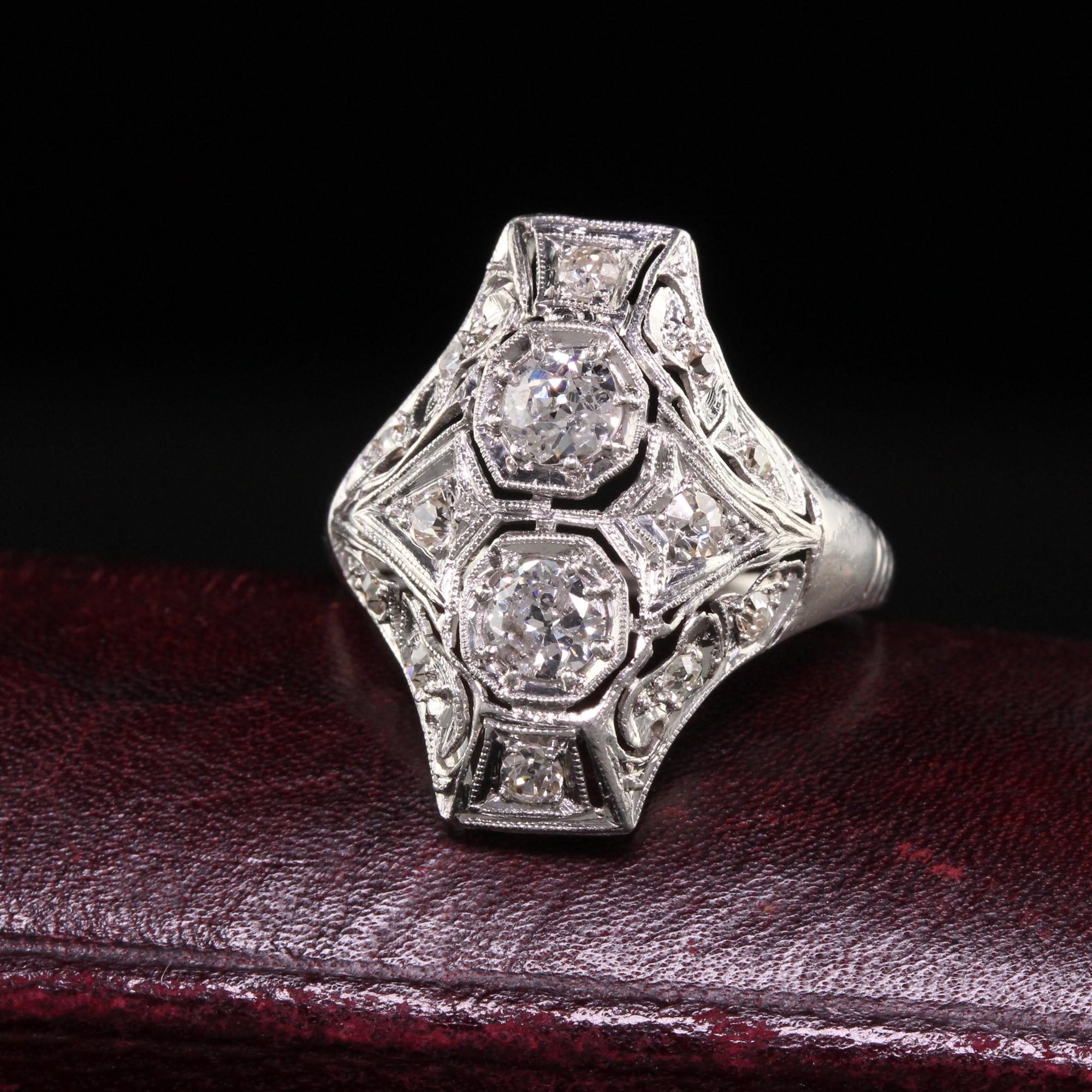 Beautiful Antique Art Deco Platinum Two Stone Filigree Shield Ring. This gorgeous ring is crafted in platinum. It has old european cut diamonds set across the top of an Art Deco filigree mounting.

Item #R1316

Metal: Platinum

Weight: 3.7