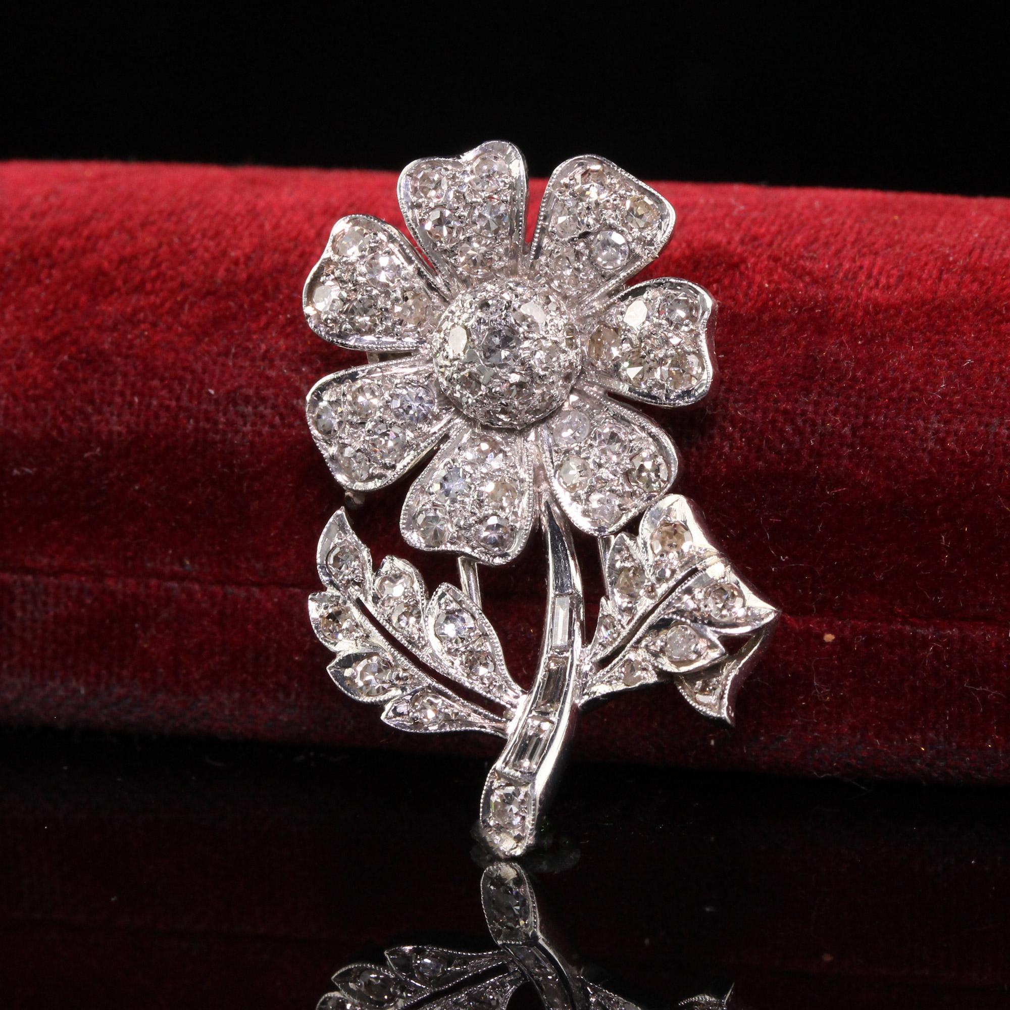 Beautiful Antique Art Deco Platinum Walser Wald Single Cut Diamond Flower Pin. This incredible pin is crafted in platinum. The pin has single cut diamonds all over the flower and petals and has baguette diamonds as the stalk. The pin is crafted