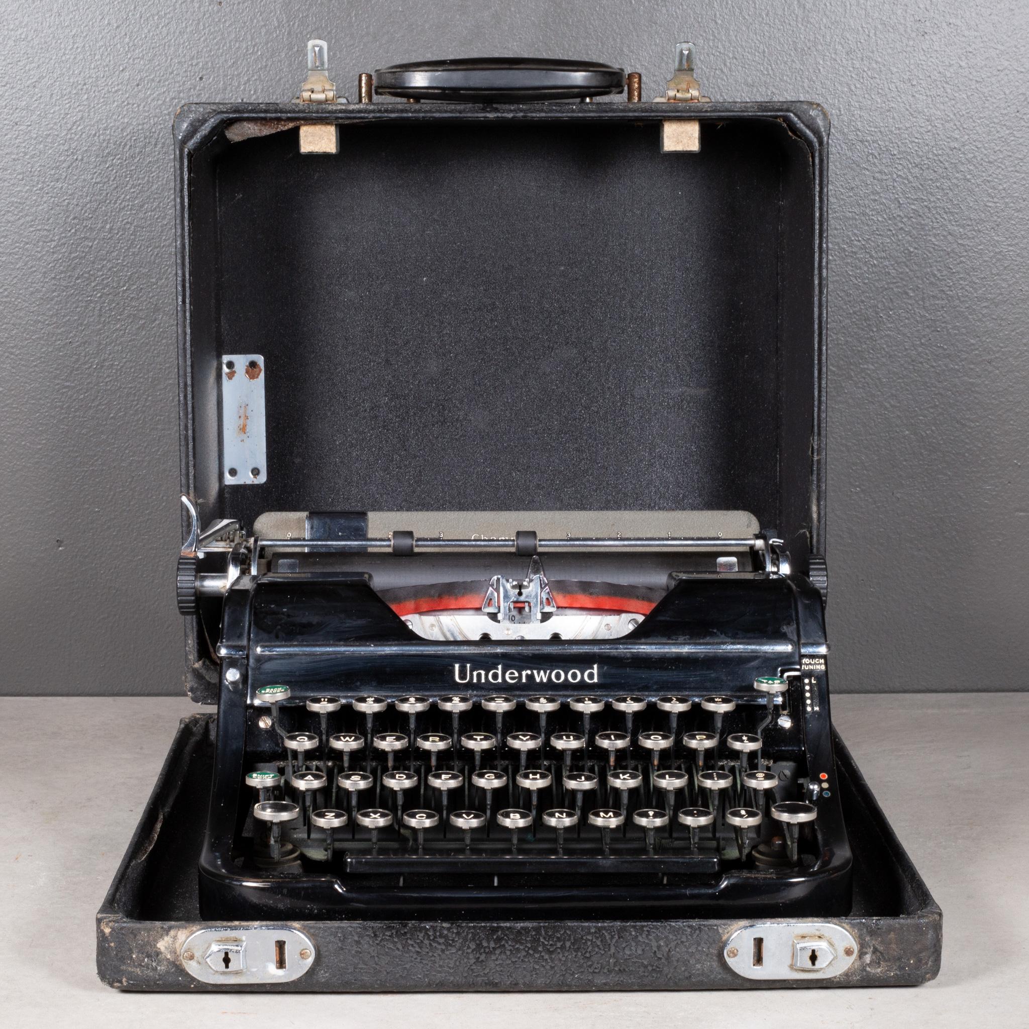 ABOUT

An Art Deco portable Underwood Champion typewriter in high gloss black finish and chrome. Bakelite and nickel keys with black and white lettering. Original Underwood lettering. This typewriter is very clean and in good working order. It has
