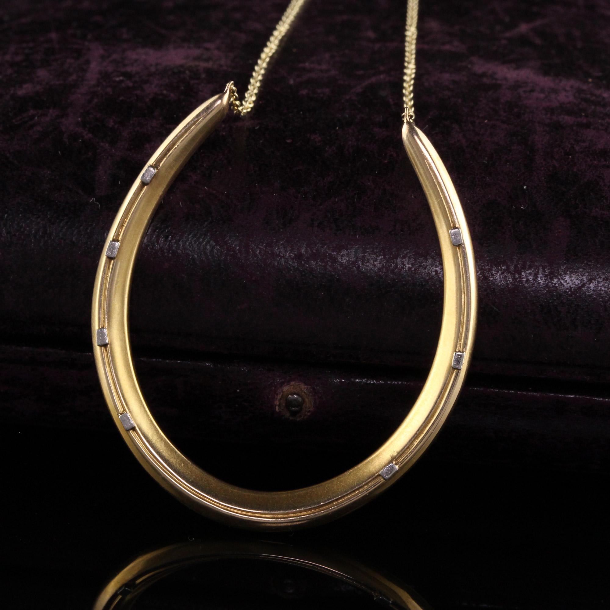 Beautiful Antique Art Deco Rikers Brothers 14K Yellow Gold and Platinum Horseshoe Necklace. This gorgeous necklace is crafted in 14k yellow gold and platinum. The horseshoe is hallmarked with the Rikers Bros mark and is in great condition. This