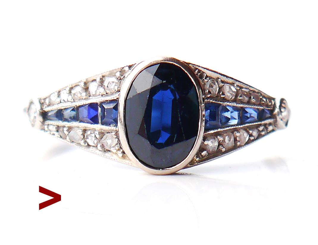 Beautiful Sapphire + Diamonds + Platinum Ring from 1900s -1920s.

All metal parts of this ring are made of solid Platinum. Crown measures 19 mm x 8 mm x 4 mm.

Beautifully oval cut natural Blue Sapphire stone of darker tone is 7.5 mm x 5.5 mm x 3.75