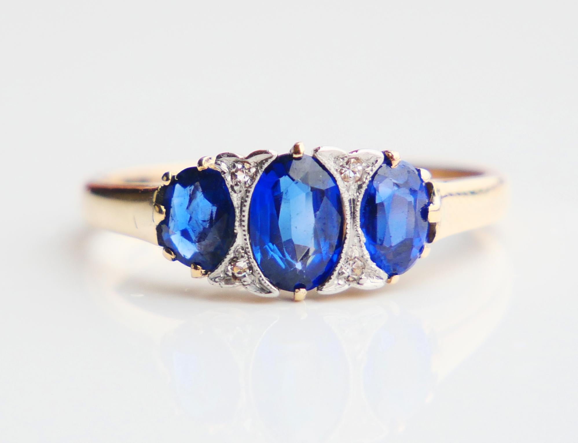 Ring in solid 14K Yellow Gold decorated with three medium Blue Sapphires and 4 old diamonds cut Diamonds in Platinum clusters.

Crown with stones measures 13 mm x 7 mm x 4 mm deep

Sapphires are lab made, largest sapphire in the center 6.25 mm x