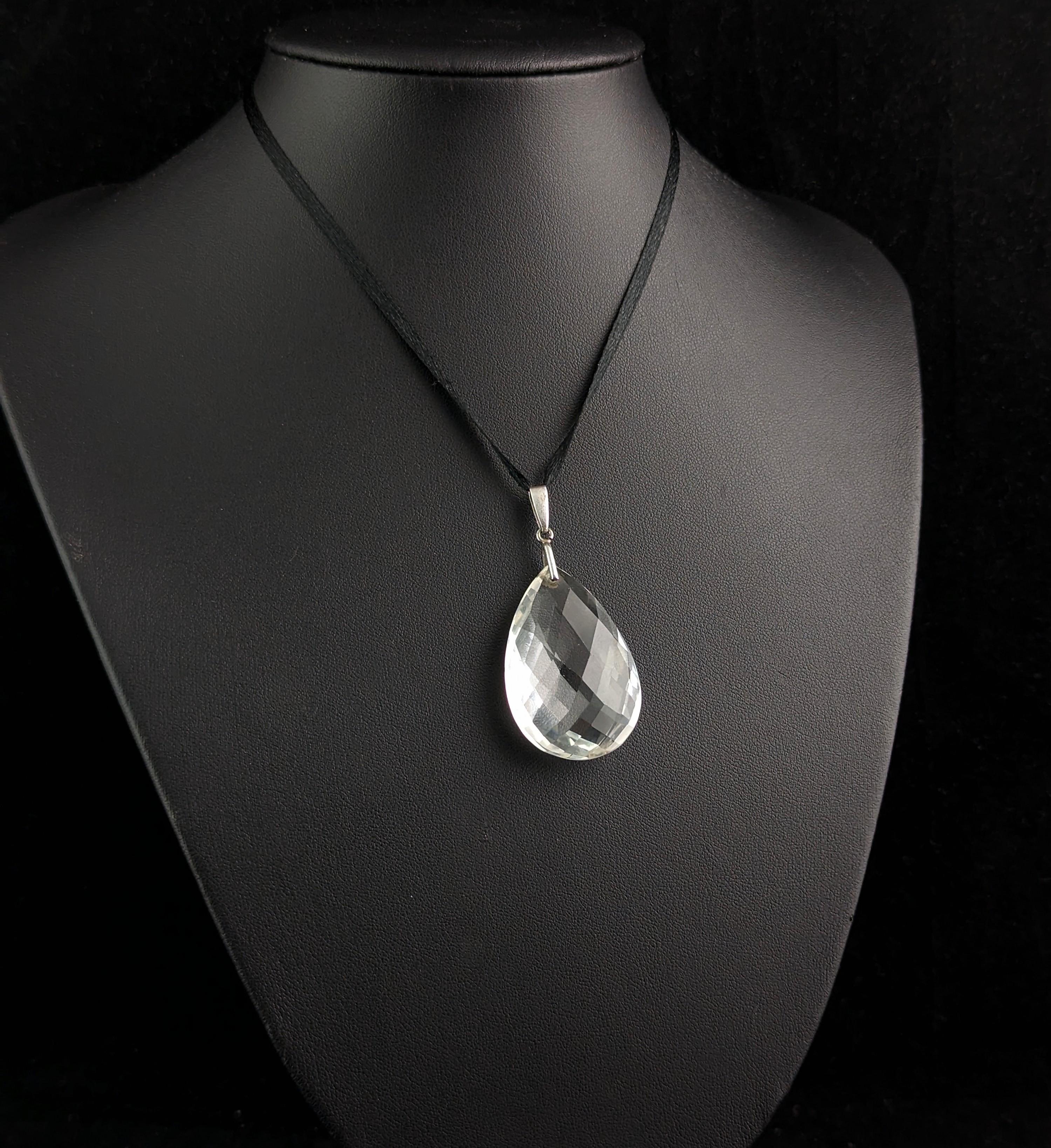 A beautiful antique, early Art Deco teardrop shaped Rock Crystal briolette pendant.

A beautifully faceted teardrop shape Rock Crystal suspended from a sterling silver bale.

The briolette cut is a most beautiful cut for gemstones, a hard cut to