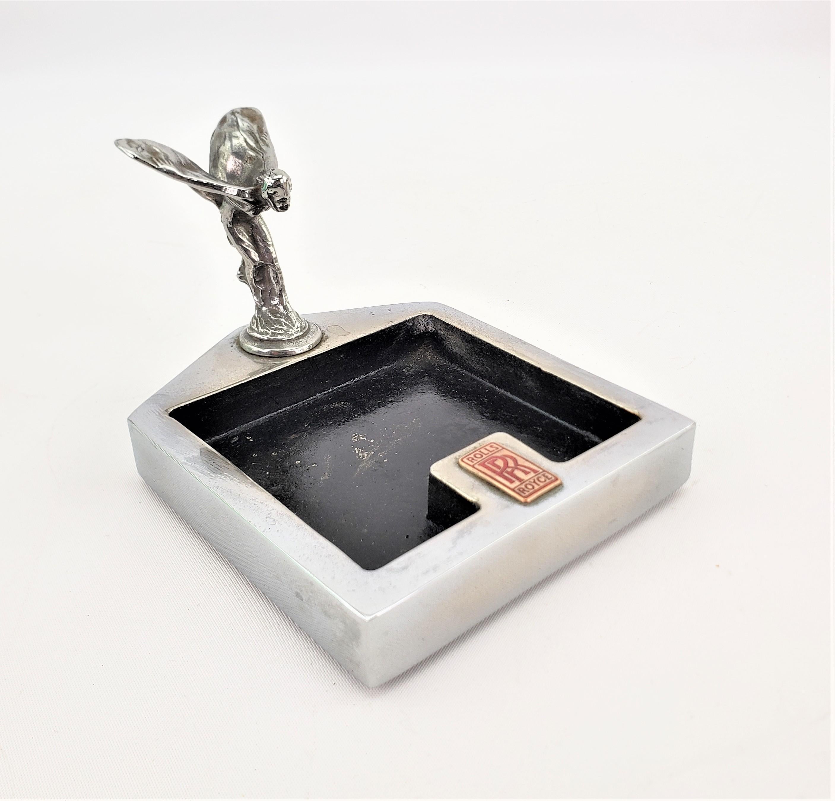 This ashtray or vide poche is unsigned, but presumed to have been made in England either by, or for the Rolls Royce Motor Cars Company in approximately 1920 in the period Art Deco style. The tray is cast metal which has been nickel plated and
