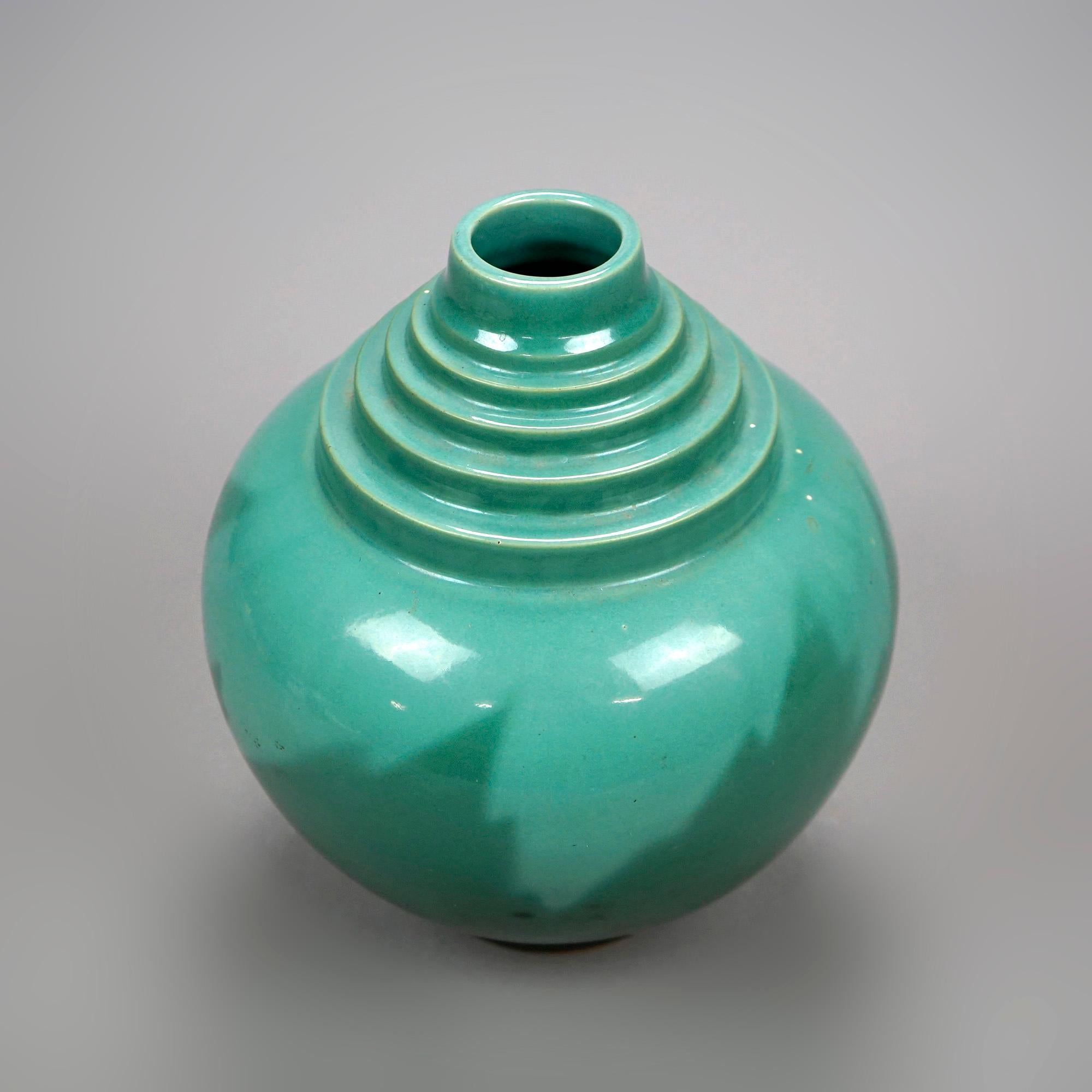 An antique Art Deco vase by Roseville of the Futura line offers spherical vessel with stepped neck, unsigned, c1930

Measures- 9.75''H x 8.25''W x 8.25''D.