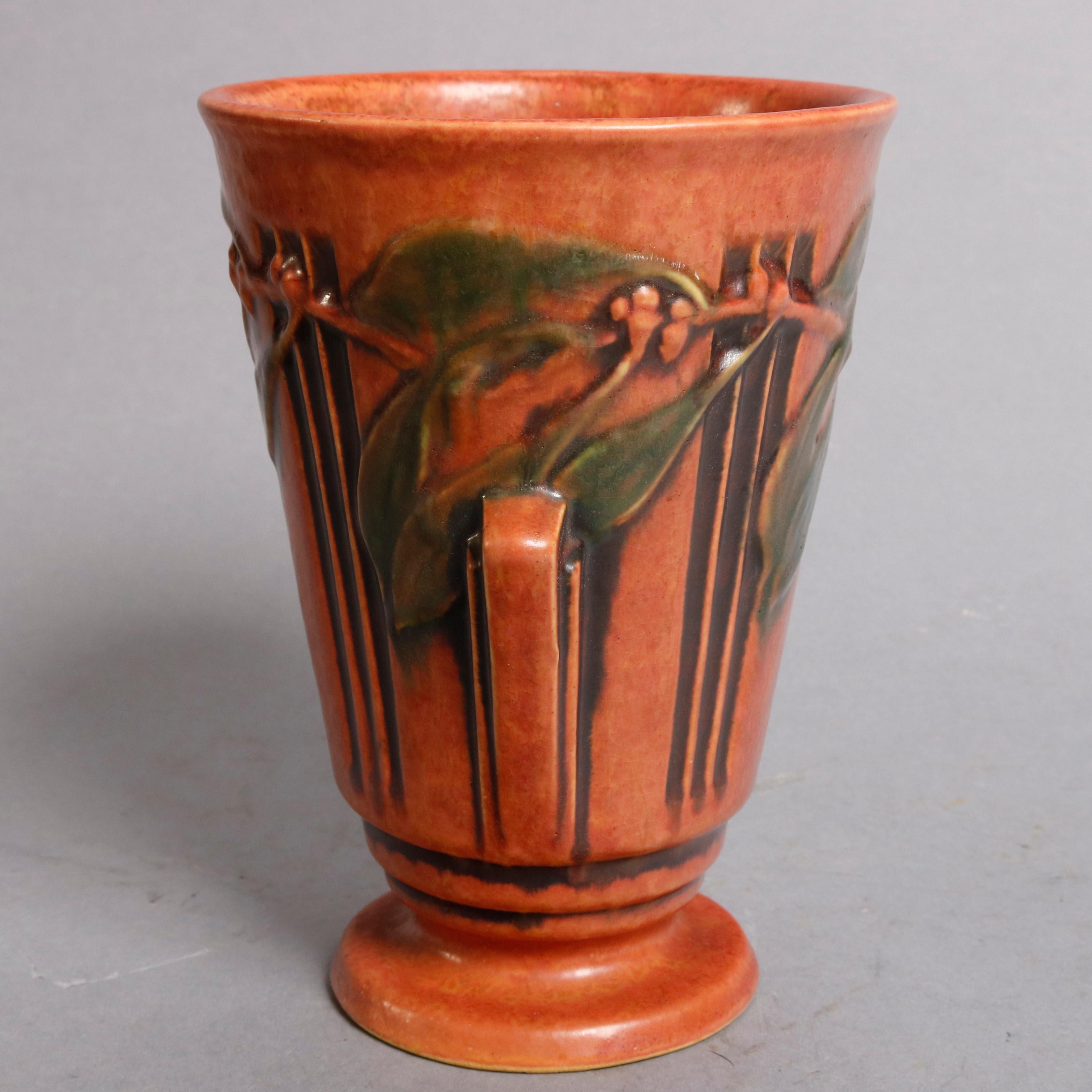 An antique Art Deco art pottery vase by Roseville in the Laurel pattern offers tapered form with ebonized decoration and laurel surround, having double geometric form handles and seated on stepped base, circa 1930

Measures: 8.25