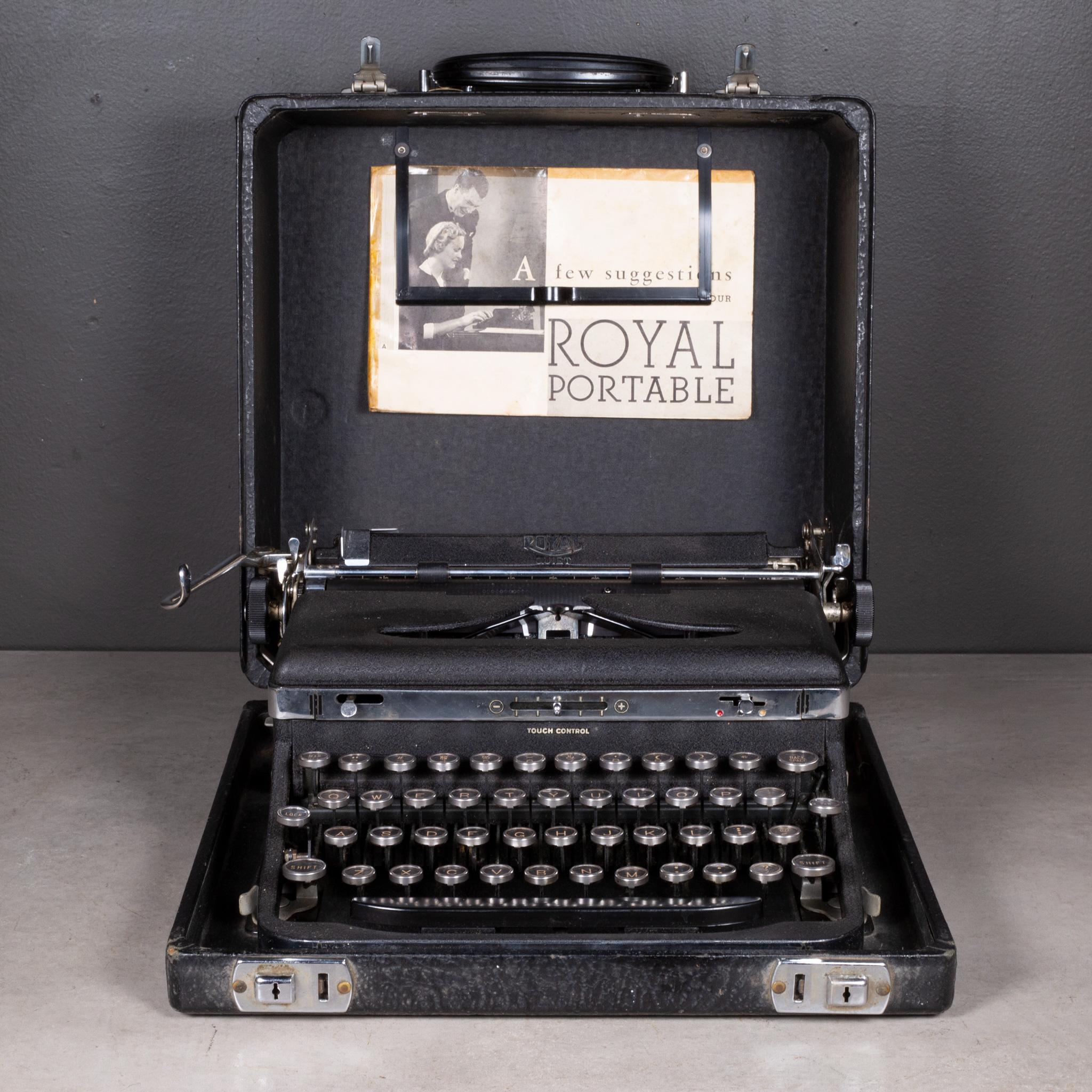 ABOUT

An antique Art Deco Royal portable typewriter in black with chrome ring. Original case with Bakelite handle. New ribbon installed. Original manual included. The keys are nickle and glass with black and gold letters. This typewriter has smooth