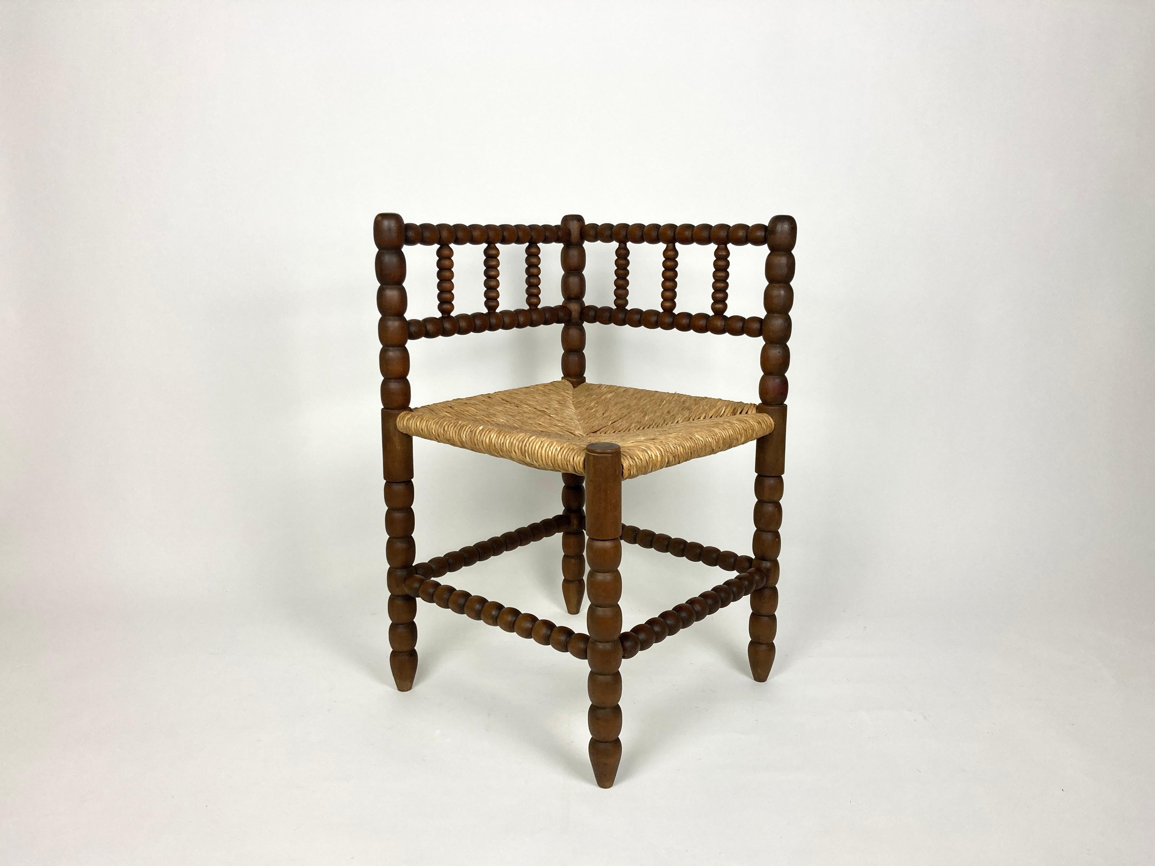 Early European (probably Dutch) 20th century oak bobbin turned corner chair with rush seat.

Excellent condition, all original, no old repairs or modifications.