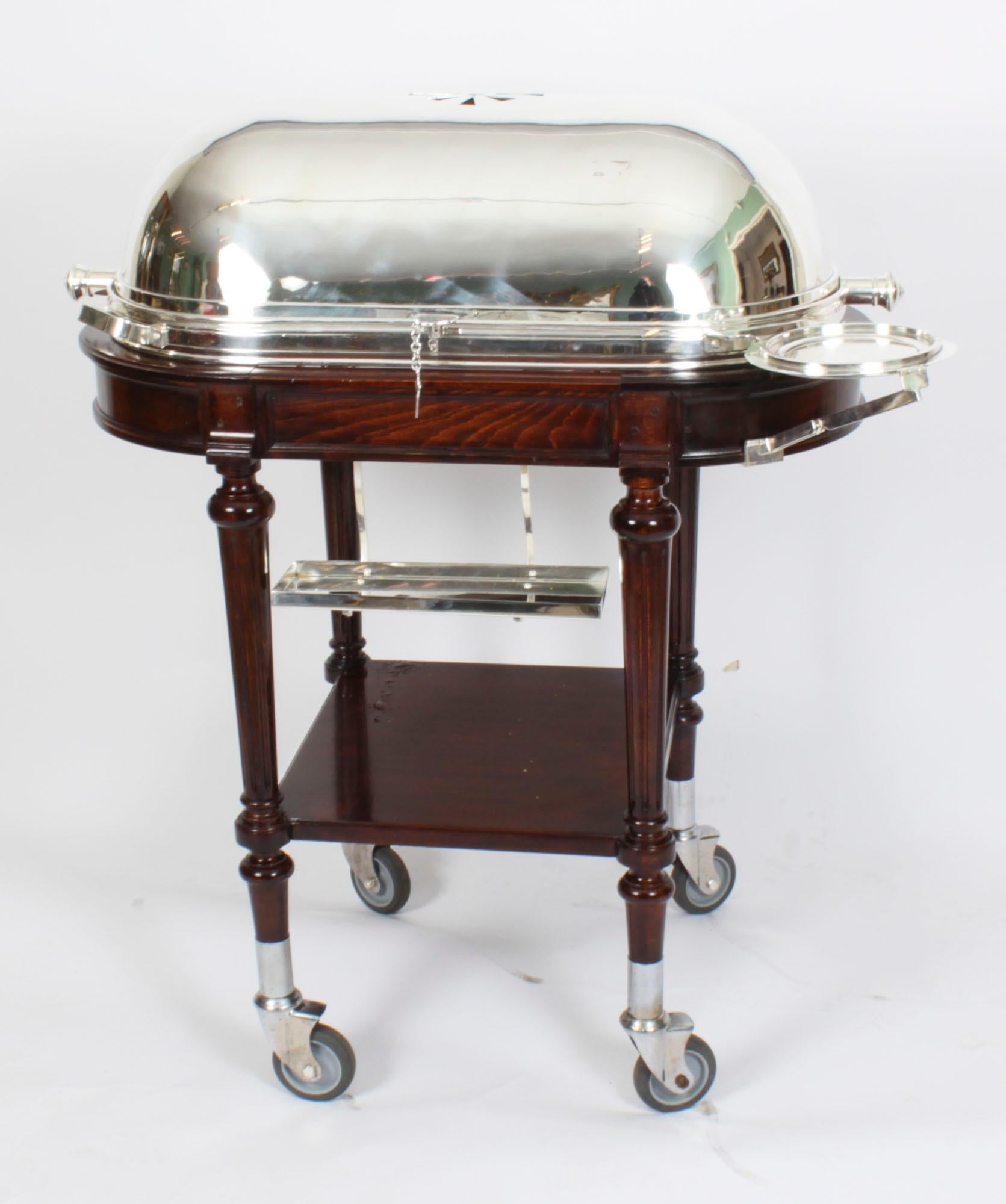 A magnificent and rare fully restored antique Art Deco silver plate beef trolley / serving cart on a decorative carved walnut base, circa 1920 in date.
 
This stunning trolley is suitable for serving cooked meats such as roast beef, lamb, and