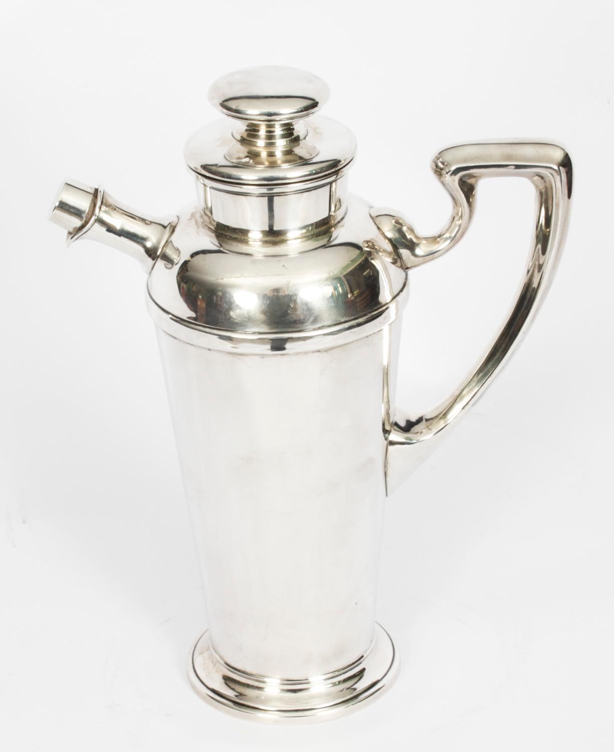A very attractive sterling silver Art Deco cocktail shaker dating from Circa 1930.
 
It bears the makers mark for Ariston Silversmith Corp of New York, a company that was active in the 1930's, and the sterling silver 925 mark.
 
There is no