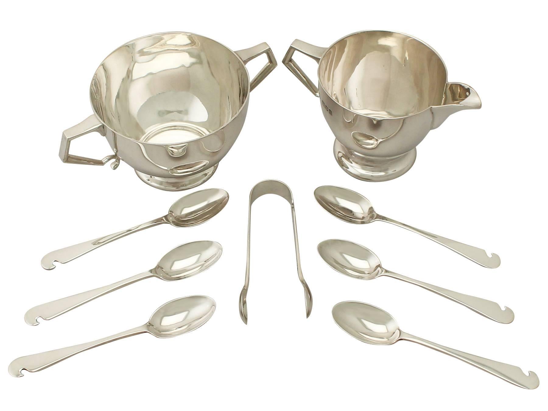 An exceptional, fine and impressive antique Edwardian English sterling silver cream and sugar presentation set made in the Art Deco style - boxed; part of our silver teaware collection.

This exceptional antique Edwardian sterling silver afternoon