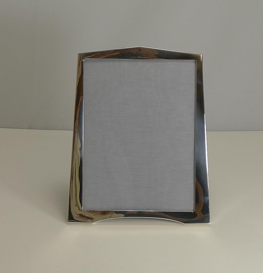 An early Art Deco era photo frame with a fabulous look, shaped at the bottom forming two 