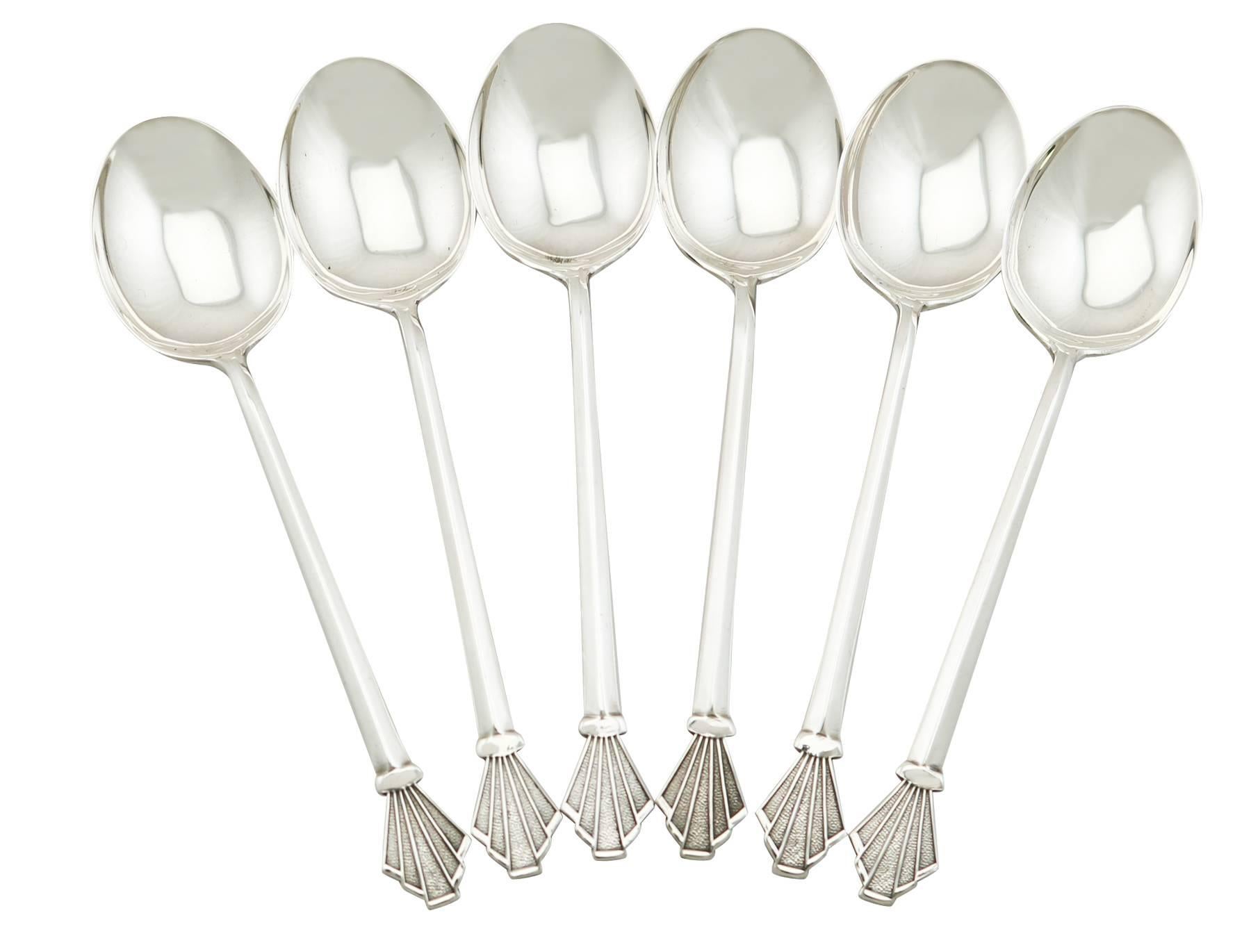 An exceptional, fine and impressive set of six antique George V English sterling silver tea / coffee spoons made by Liberty & Co Ltd, in the Art Deco style - boxed; part of our collectable silverware collection.

These exceptional antique George V