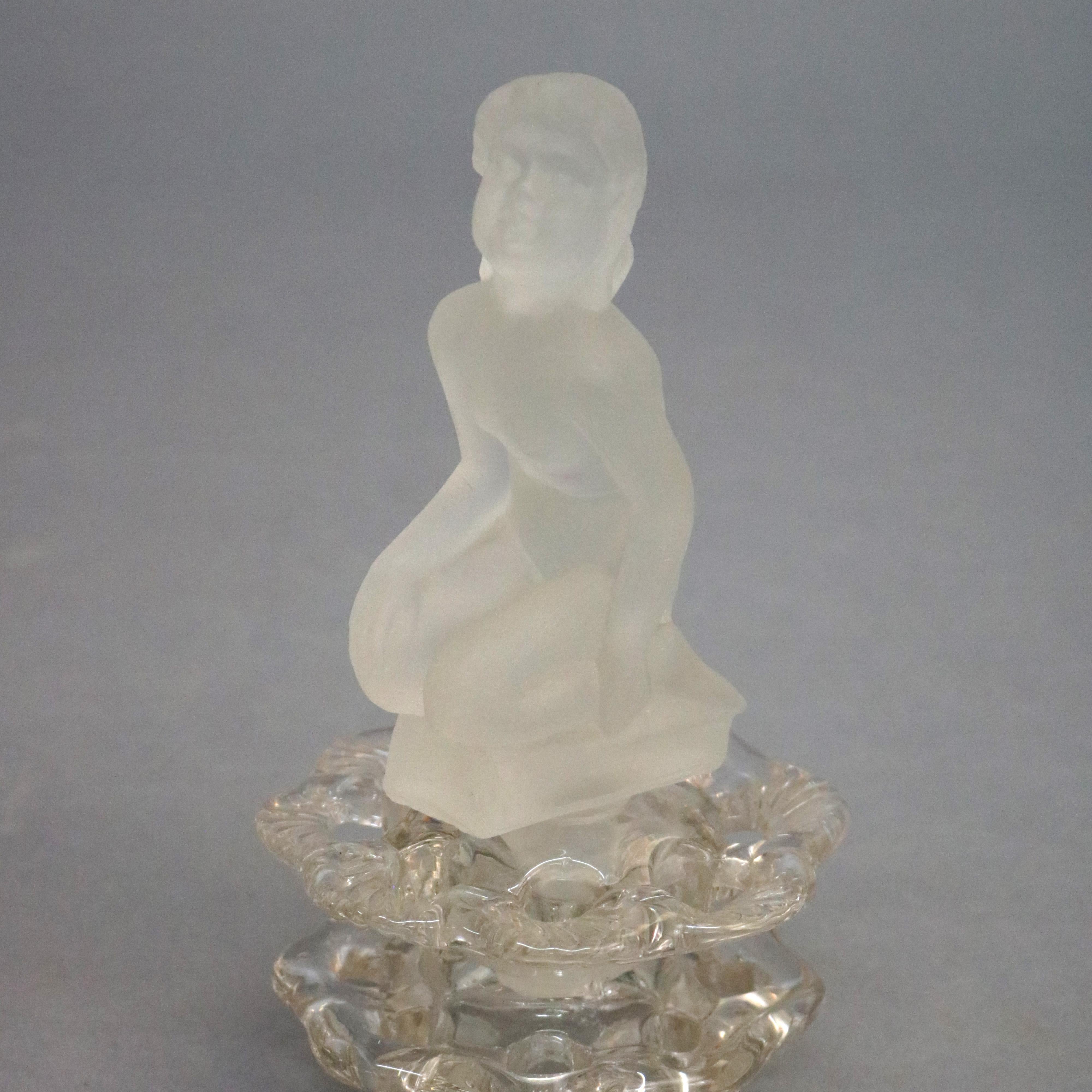 Art Deco Steuben figural art glass flower frog features frosted glass nude of woman surmounting crystal base, circa 1930

Measures: 6.75