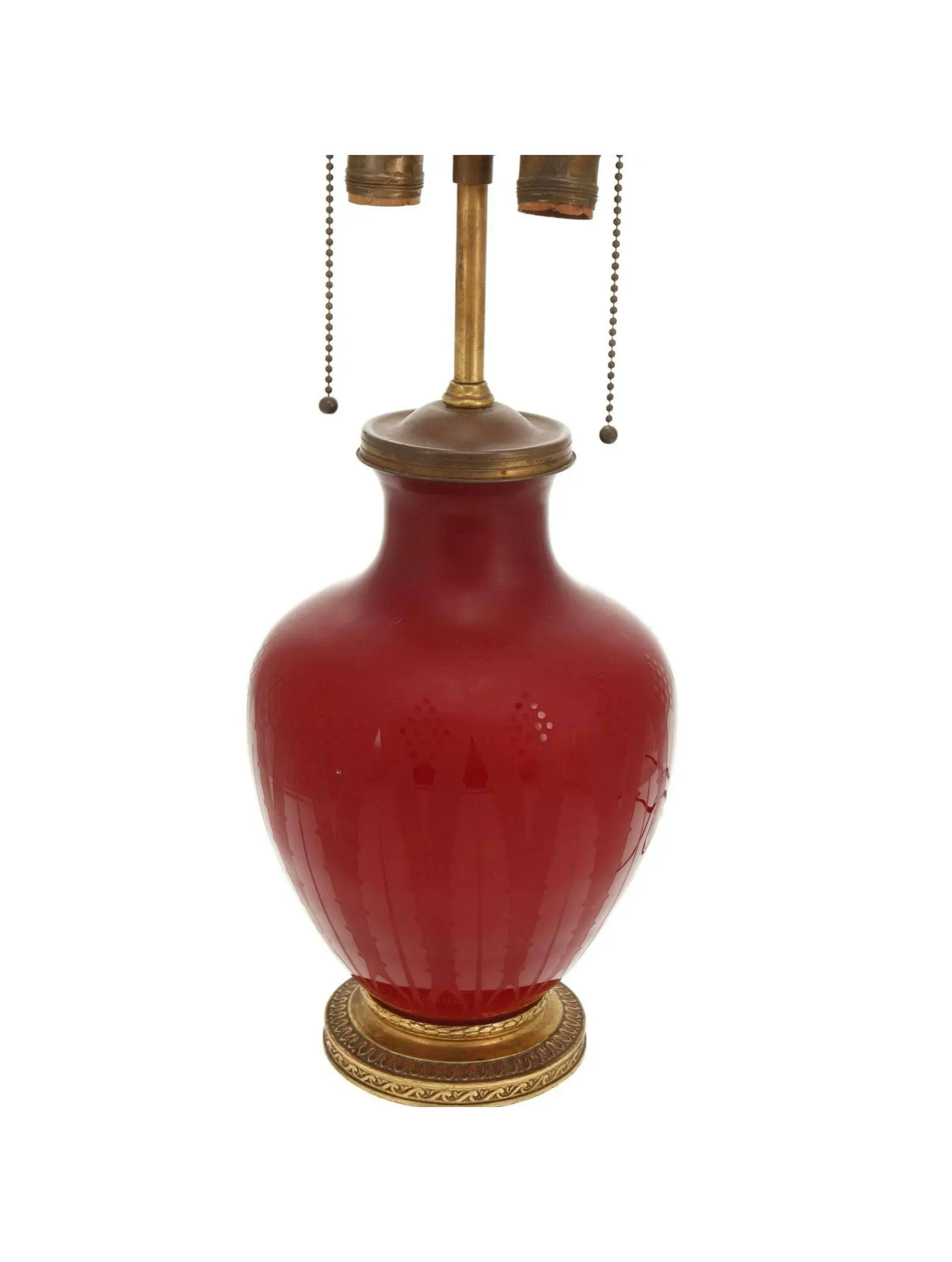 Antique Art Deco steuben red acid etched glass lamp.

Additional information: 
Materials: Etching, Glass
Color: Red
Brand: Steuben
Designer: Steuben.
Period: 1920s.
Styles: Art Deco.
Lamp Shade: Not Included.
Power Sources: Up to 120V (US