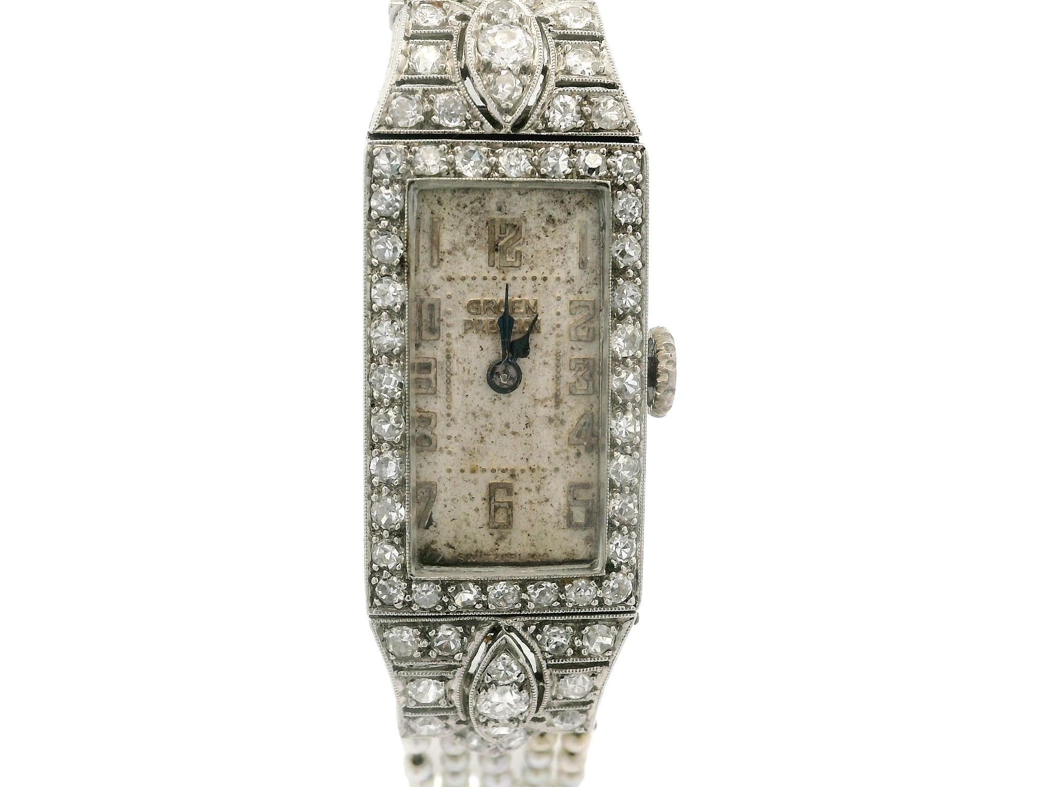 --Stone(s):--
(74) Natural Genuine Diamonds - Old Mine Cut - Pave Set - 0.88ctw (approx.)
Numerous Natural Genuine Seed Pearls - Round Beads - 1.7-1.9mm (approx.)

Case Material: Solid Platinum 
Case Overall Height: 42.9mm (1.69