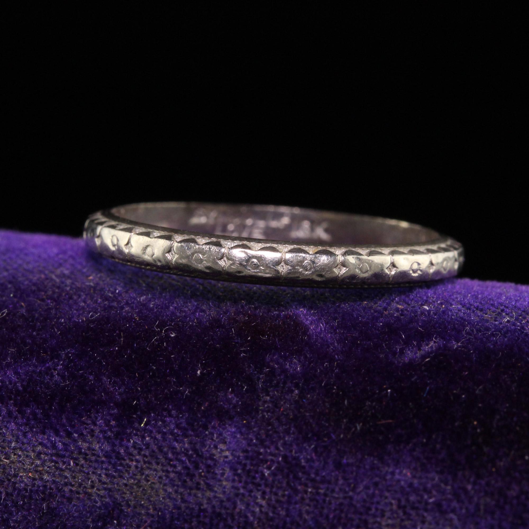 Beautiful Antique Art Deco Symbol of Love 18K White Gold Engraved Wedding Band. This gorgeous wedding band is crafted in 18k white gold. The ring is beautifully engraved around the entire ring and is in great condition.

Item #R1429

Metal: 18K