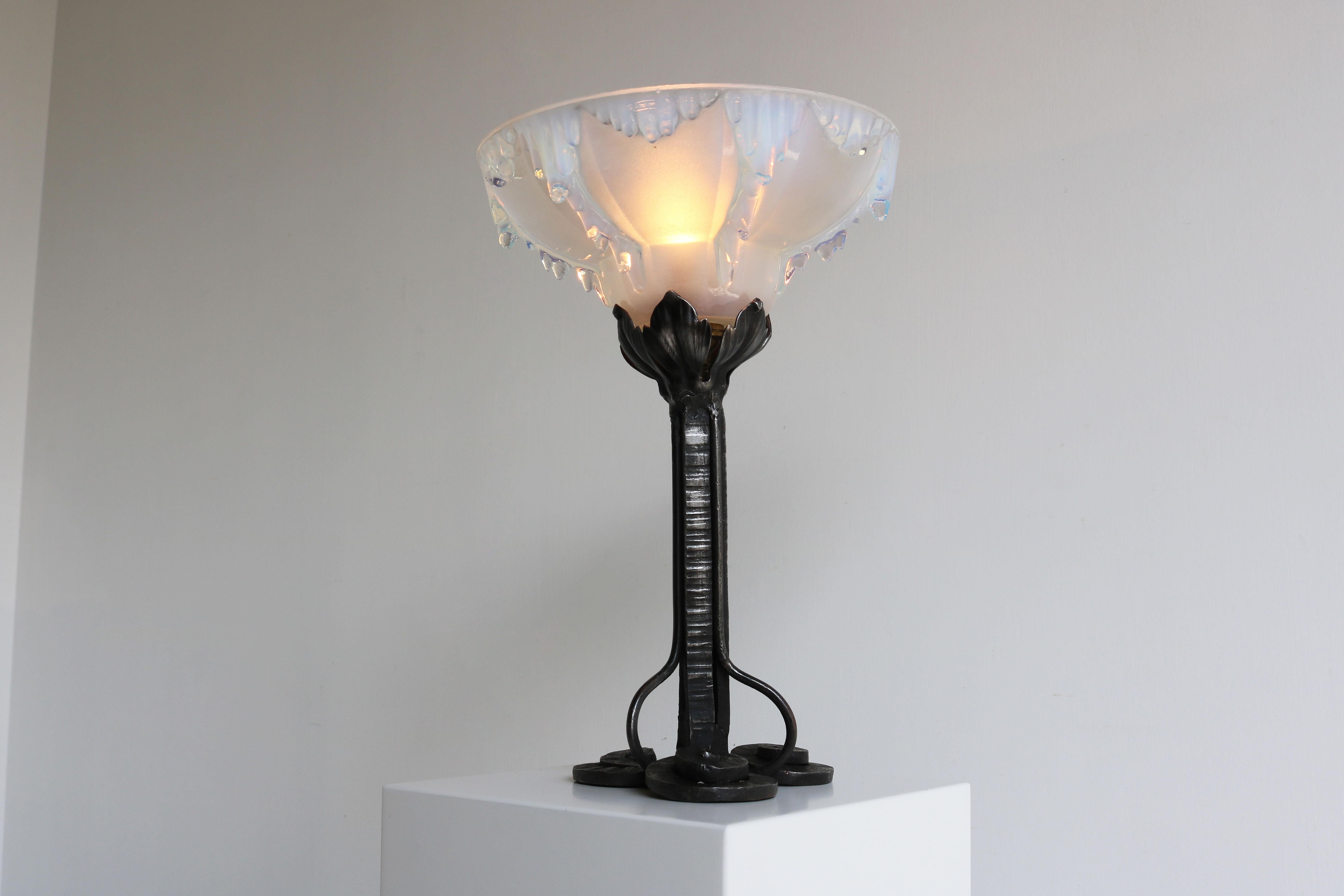 Gorgeous Antique French Art Deco table lamp designed by Ezan with gorgeous singed ice glass shade & hand made wrought iron frame. 
The glass is simply stunning and the ice effect combines nicely with the wrought iron frame. 
The frosted glass by