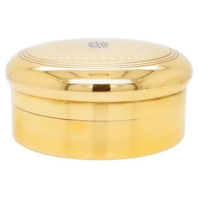 A fine Art Deco pill box.

By Tiffany & Co.

In 18k gold with a cobalt blue enamel monogram to the center.

Fully hallmarked to the bases for Tiffany & Co. and marked with an M for the directorship of John C. Moore II (1907 - 1947).

Simply a