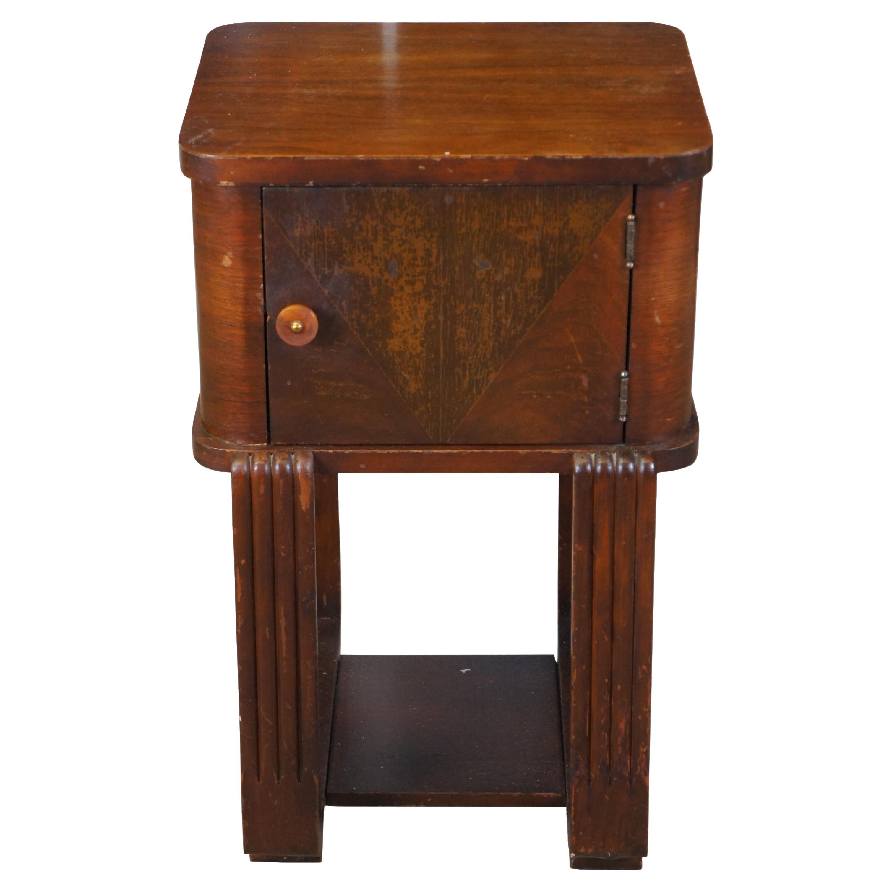 Antique humidor smoking stand side table.  Made of walnut featuring square form with Bakelite knob, copper lined cabinet, and fluted legs.

Dimensions:
14