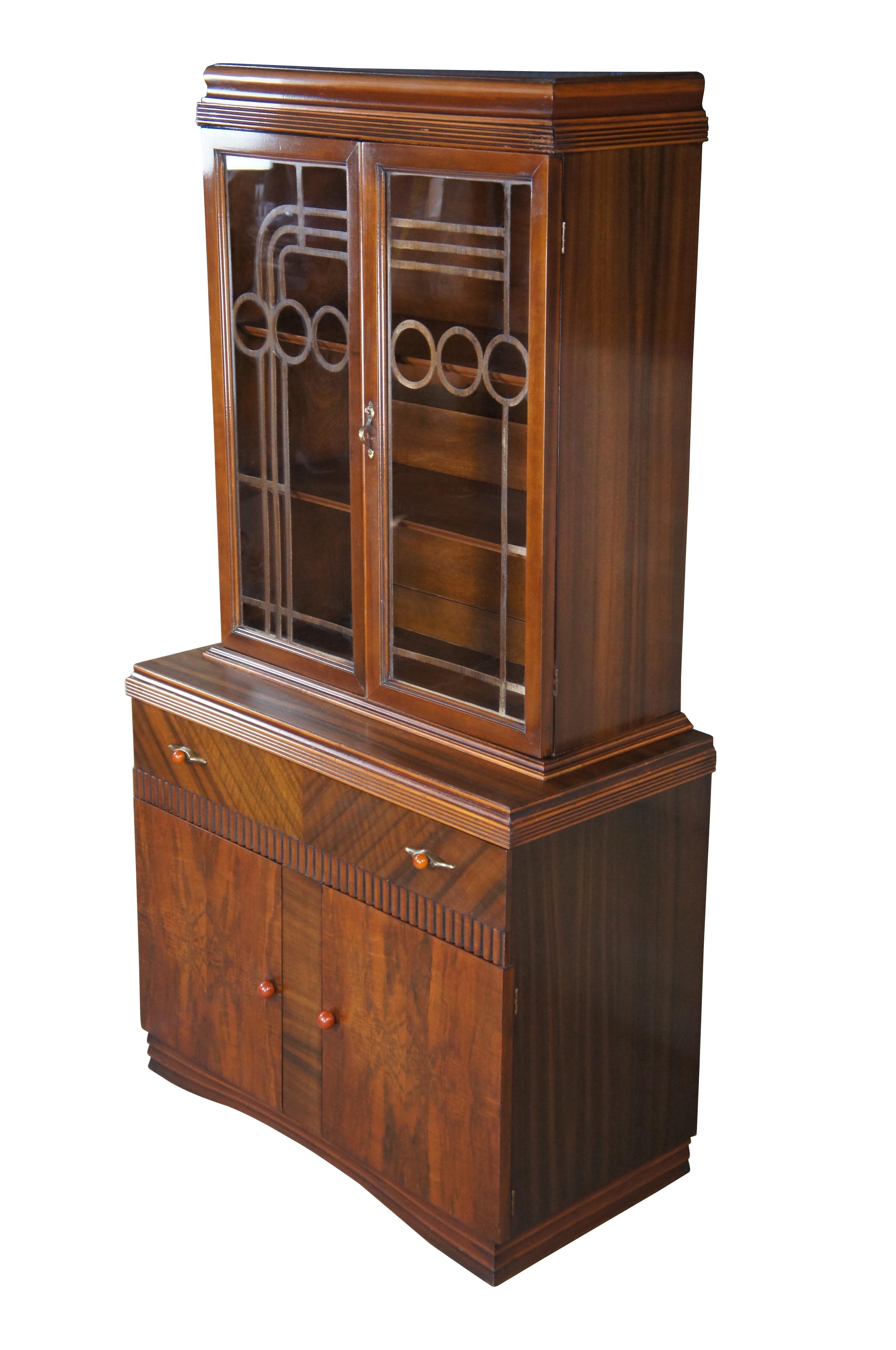 An amazing Art Deco display cabinet, circa 1930s. Made from walnut with an intriguing 