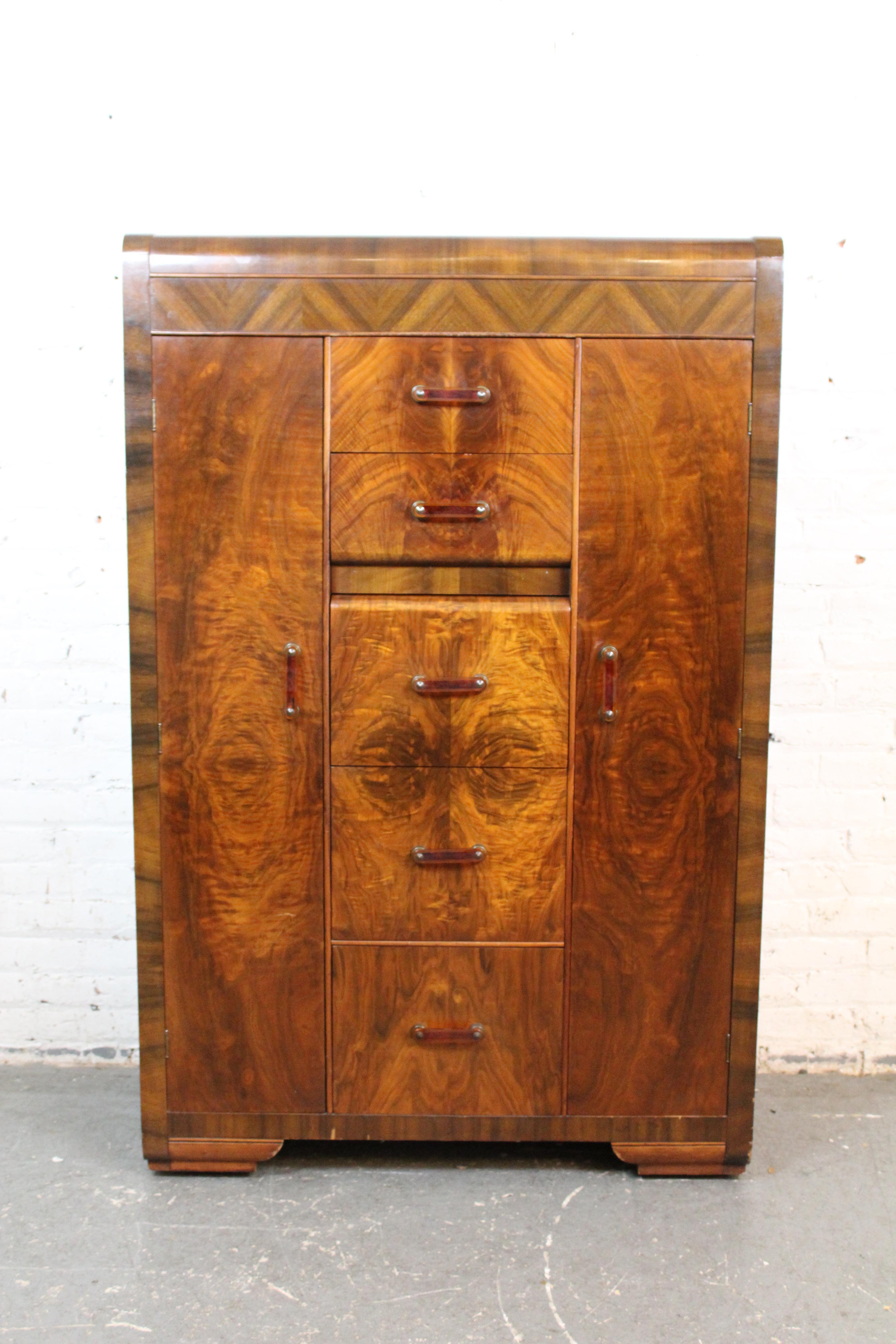 Bring home the organic luxury of the Art Deco era with this exceptional American-made burl chifforobe. With soft 