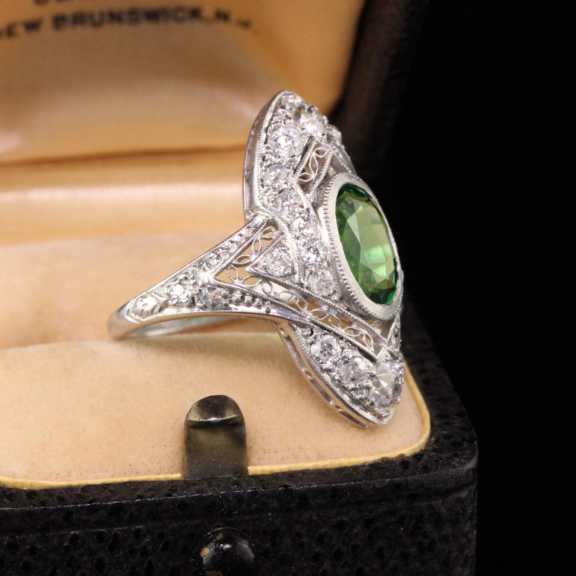 Beautiful Antique Art Deco William Wise and Son Platinum Tsavorite Diamond Filigree Shield Ring. This beautiful ring is in great condition and has laced filigree work on it without any damage. Its a true work of art!

Item #R0668

Metal: