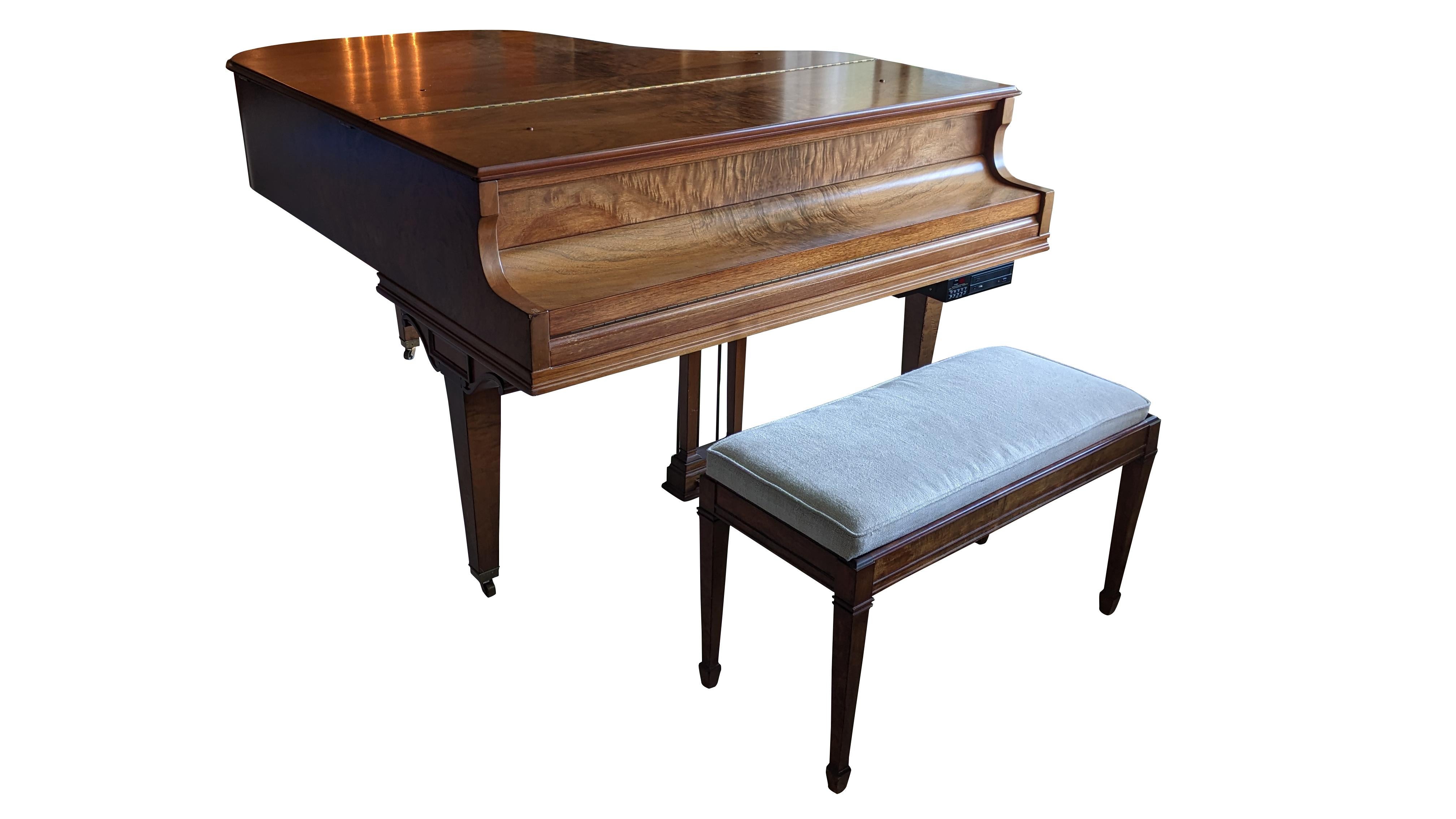 A stunning WM. Knabe & Company Late Art Deco Baby Grand Player Piano, circa 1935-1939 (serial no. 111688). Features a stunning matchbook walnut case complete with 88 keys, a music holder, and QRS Pianomation 2000CD+ Player. The piano is paired with
